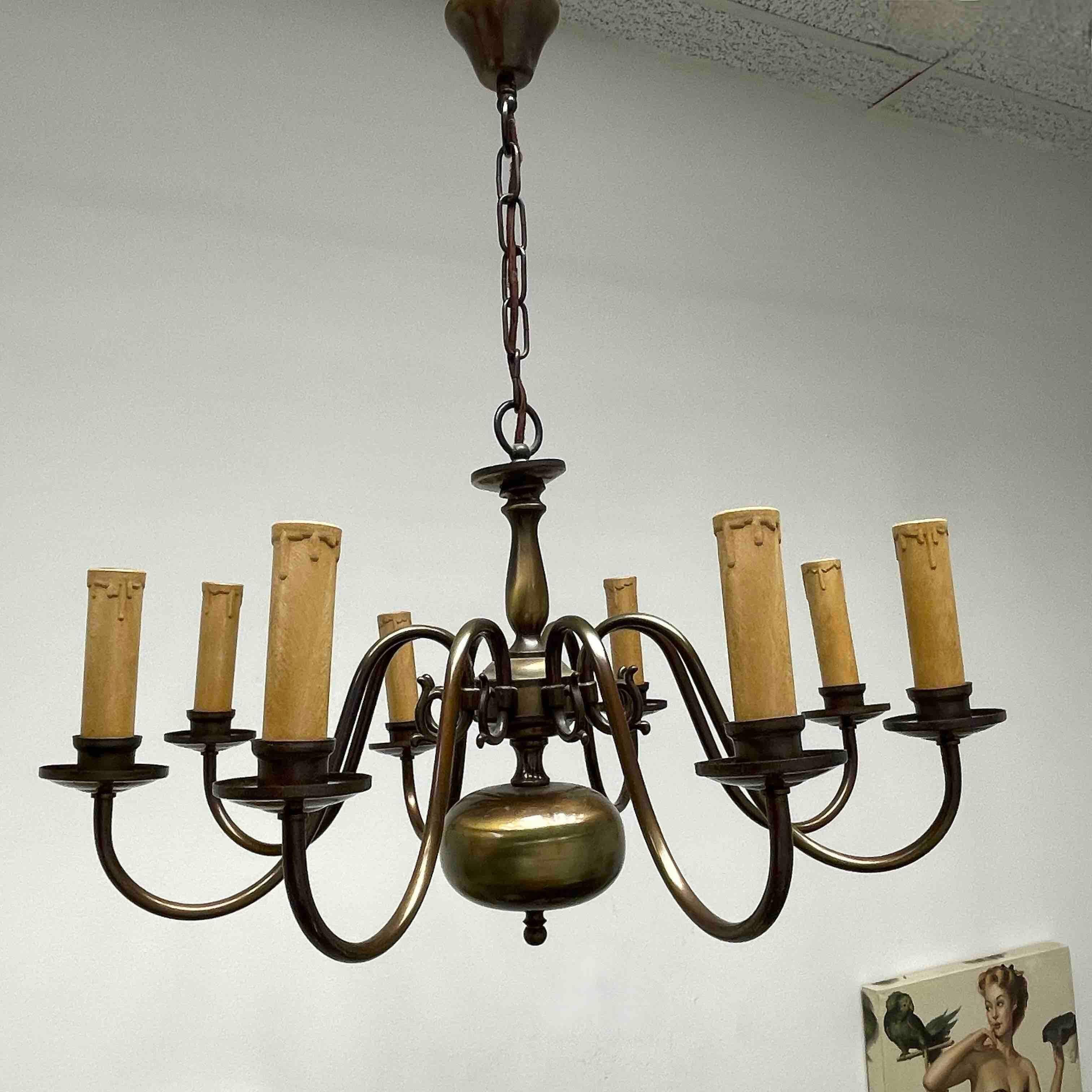 Add a touch of opulence to your home with this charming chandelier! Perfect burnished Metal to enhance any chic or eclectic home. We'd love to see it hanging in an entry hall or in a Living / Dinning room area. Built in the 1930s, attributed to a