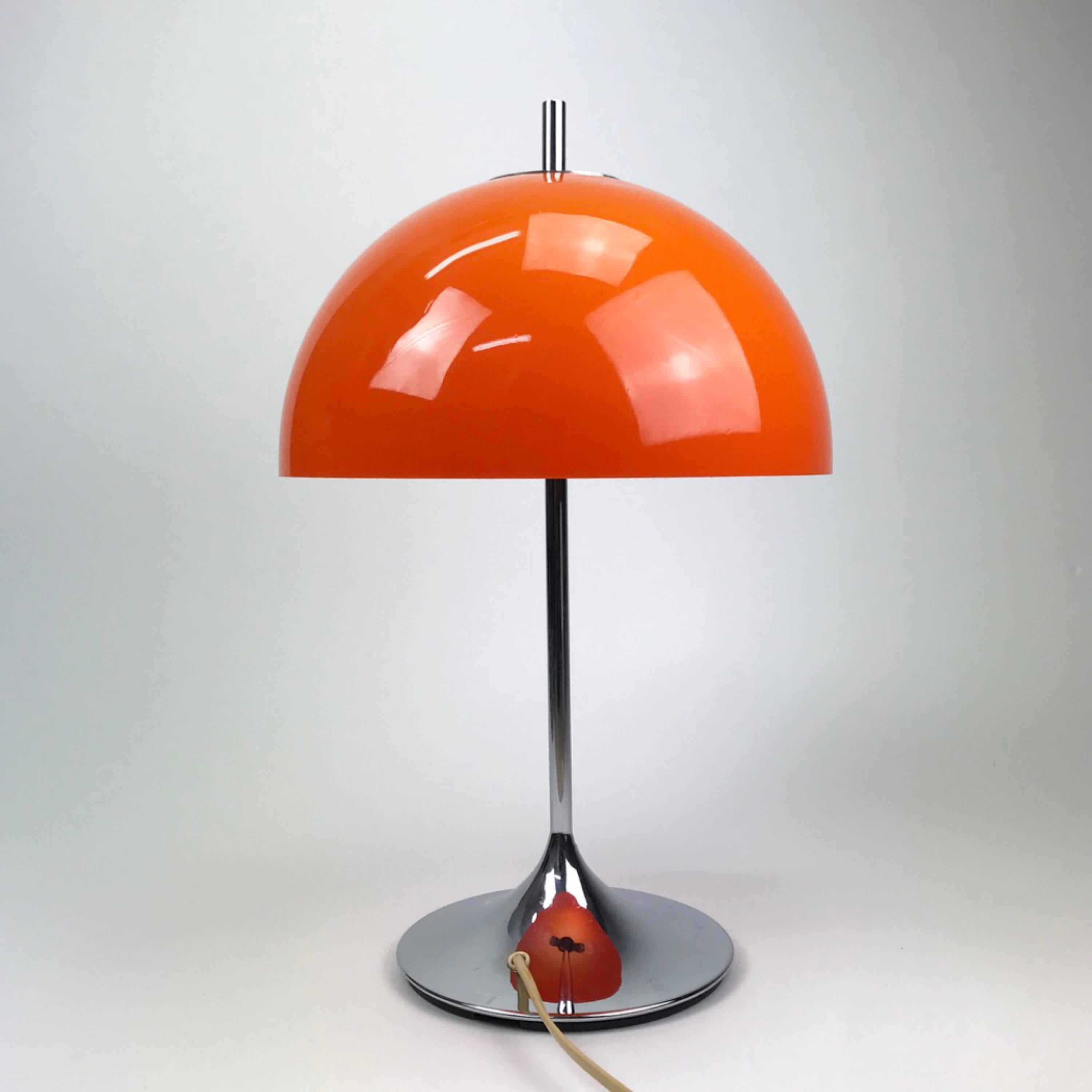 Chrome combined with orange perspex shade is the right ingrediens to create a cool classic space age light. This amazing light is perfect in the contemporary home where you need to add some space age touch. 

Perfect as a desk light or beside