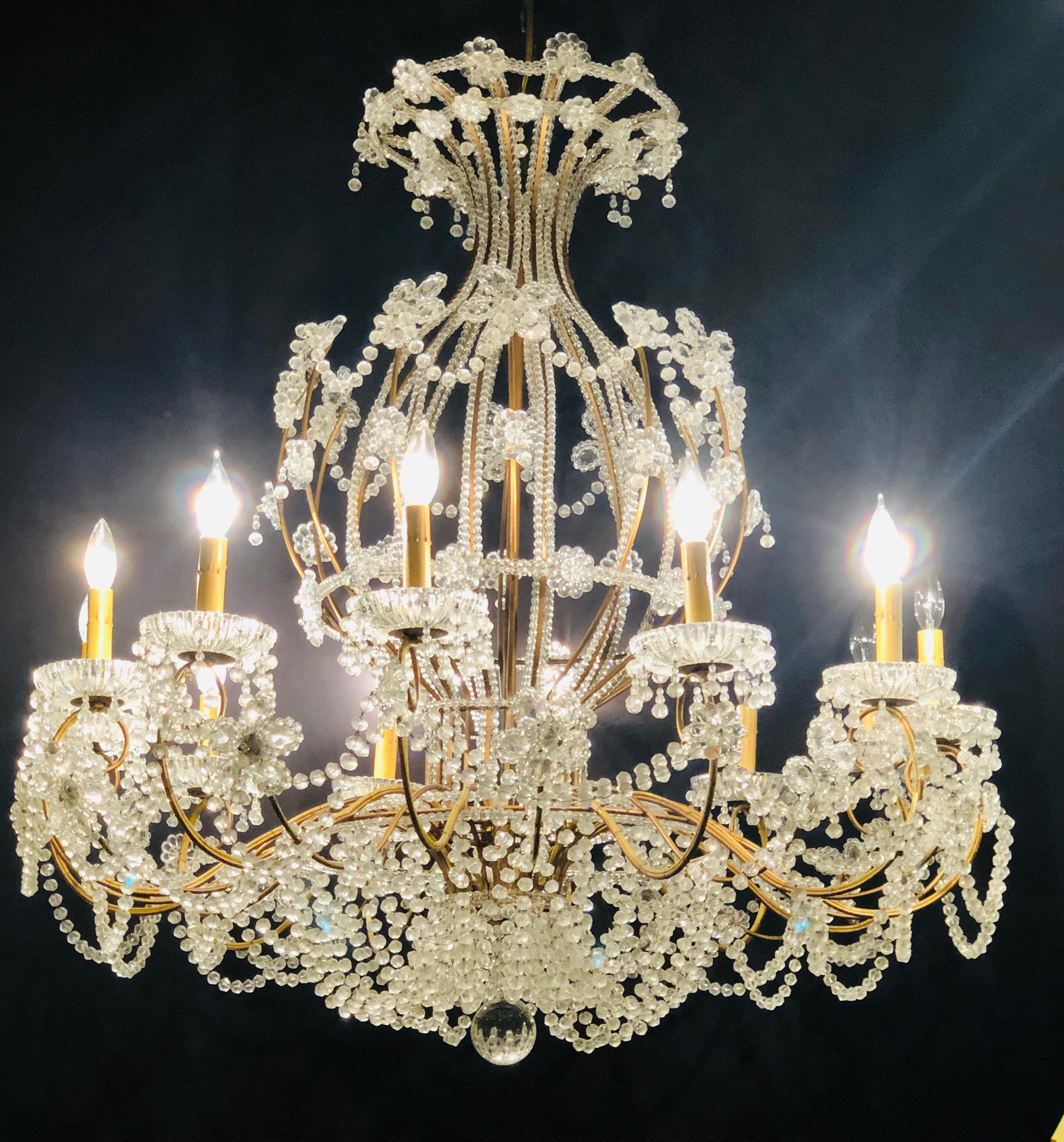 Hollywood Regency Beautiful Gilt Iron 12-Light Chandelier with Great Crystal and Bead Decoration