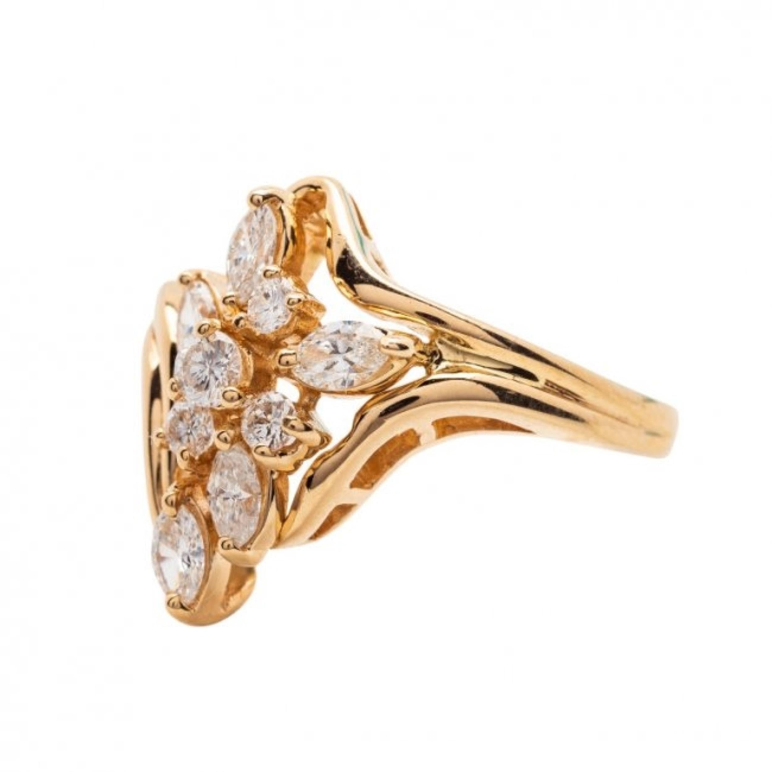Beautiful Gold and Diamond Ring, signed Trev
14 Karat Yellow Gold and Diamonds
set with five marquise and four round-cut diamonds weighing approximately 0.75 ct. 
6.7 grams, size 7 1/4