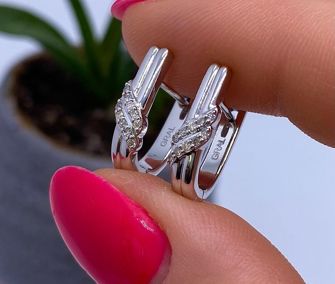 Natural Diamonds
14 Karat White Gold Earrings

Main Stone: Diamond
Main Stone Creation: Natural
Main Stone Color: white
Clarity: SI1
Diamond total weight: 0.21ct
Main stone size: 1.2mm
Earrings Size: 16x4.5mm
Earrings weight: 3.72gr
Main Stone