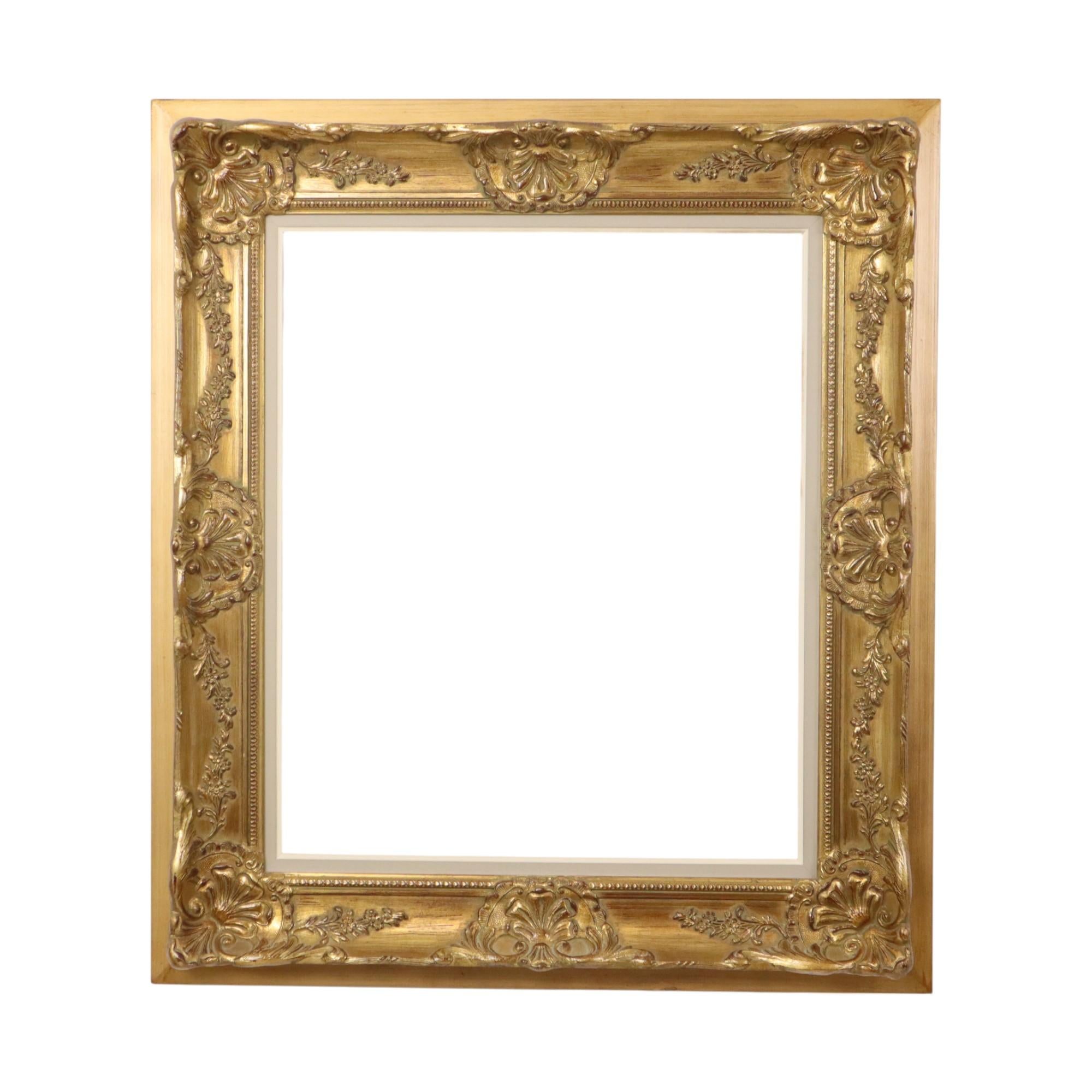 Beautiful, classic frame gilded with gold leaf, entirely in the typical Baroque style, lavishly decorated with acanthus leaves, vines, flowers, and a dotted pattern all around. Made of pine and plaster, circa the first half of the 20th