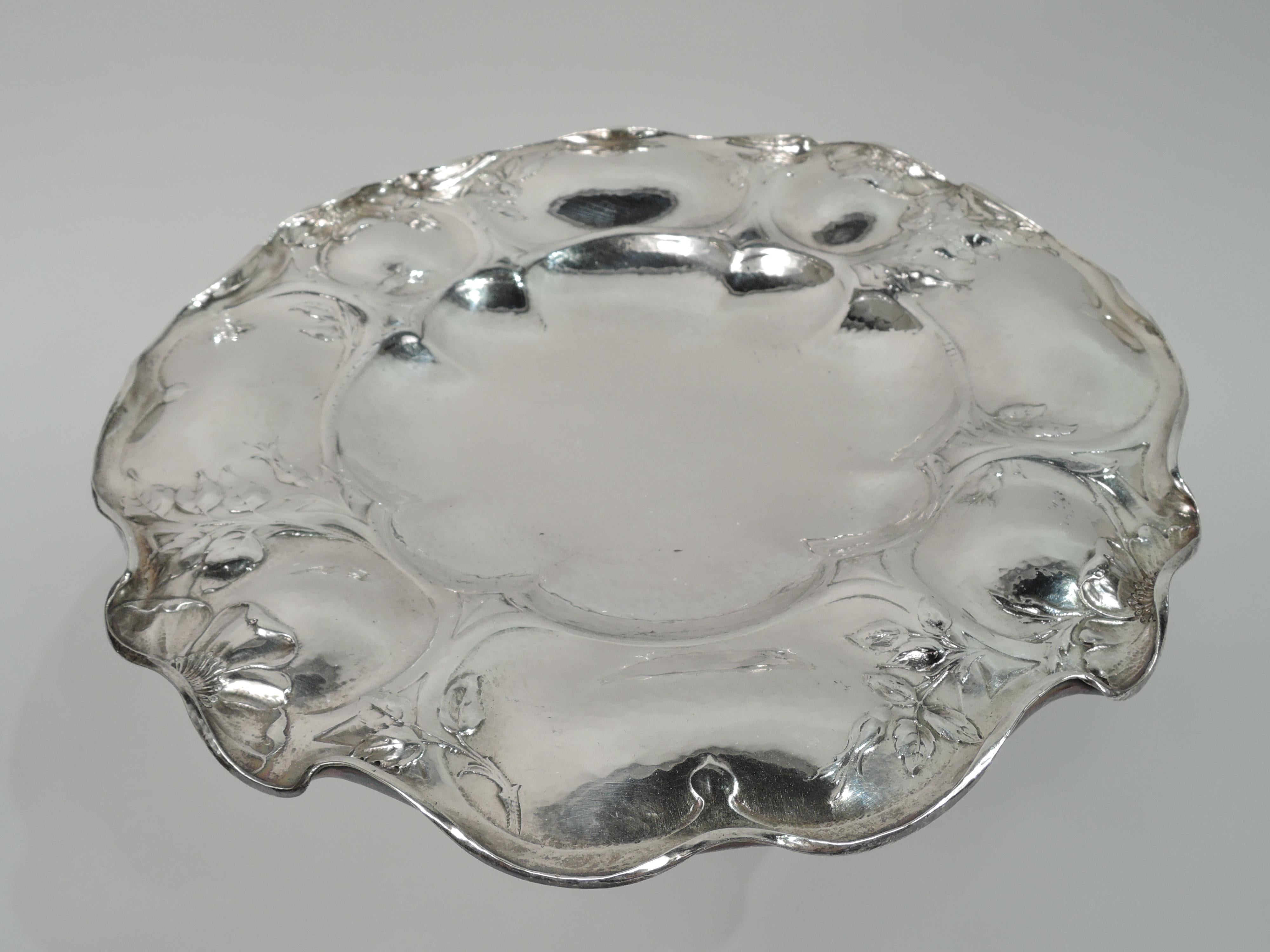 Beautiful Art Nouveau Martelé silver compote. Made by Gorham in Providence on August 16, 1917. Shallow bowl with alternating big and small lobes; shoulder same with leaves and flowers overlapping and entwined in strapwork frames. Rim irregular and