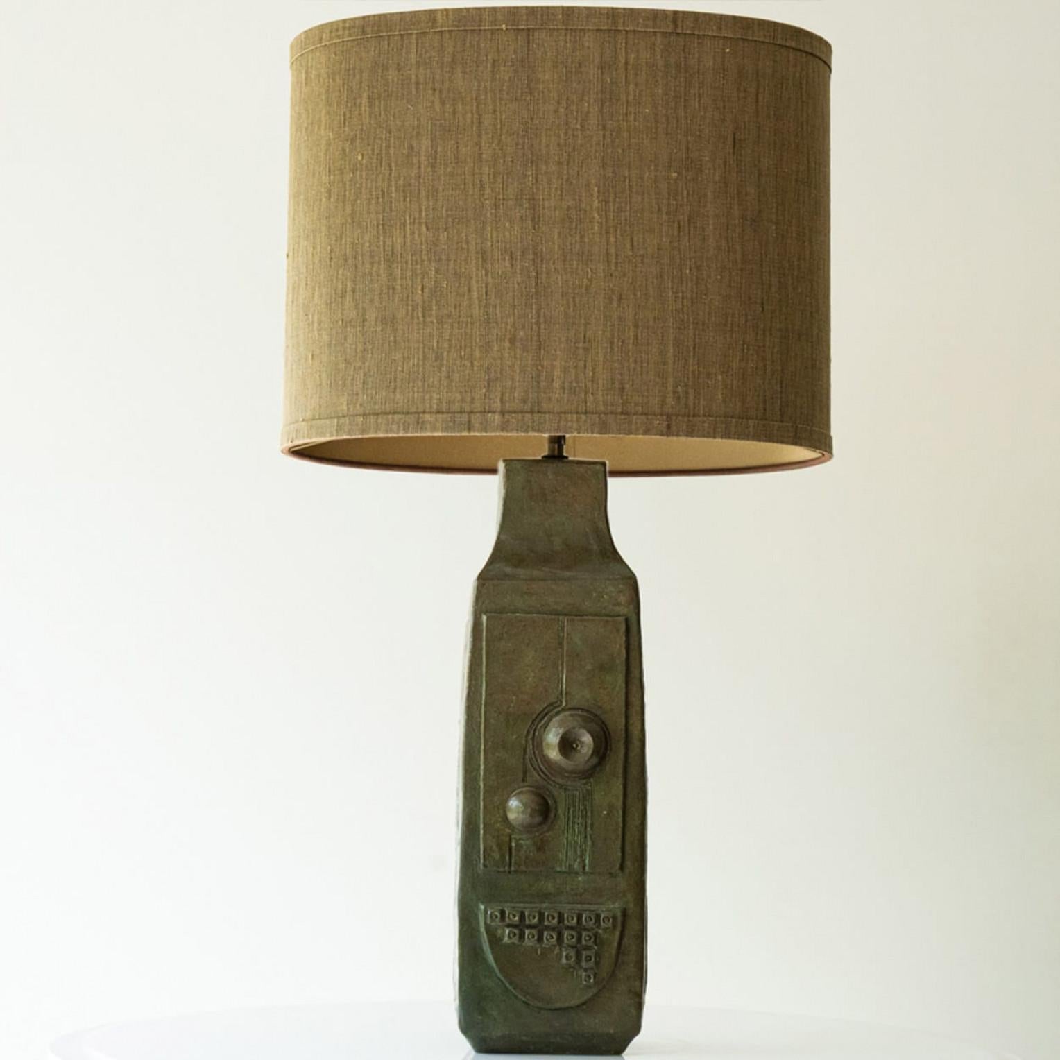 Beautiful ceramic table lamp, 1970s.

This lamp base brings refined elegance and rich visual appeal to any interior. With its beautiful shape, it offers a unique presence. 

This base with green brown tones fits perfectly with the beige custom made