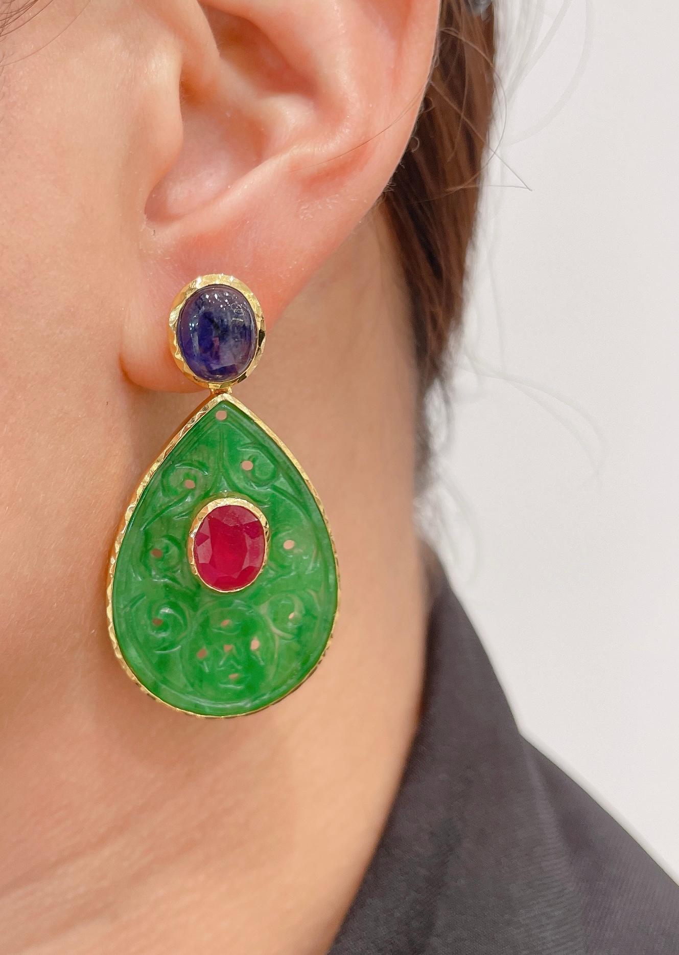 Bochic Beautiful Jade, Sapphire and Ruby Earrings 
Natural Ruby’s 6 Carats / Natural 
Color - Red 
Shape - Ovals 
Set in the Green Jade 
Natural Deep 6 Carats Blue sapphire from Sri Lanka 
Shape - Cabochons
Set on the tops 
22K Gold and Silver 
3