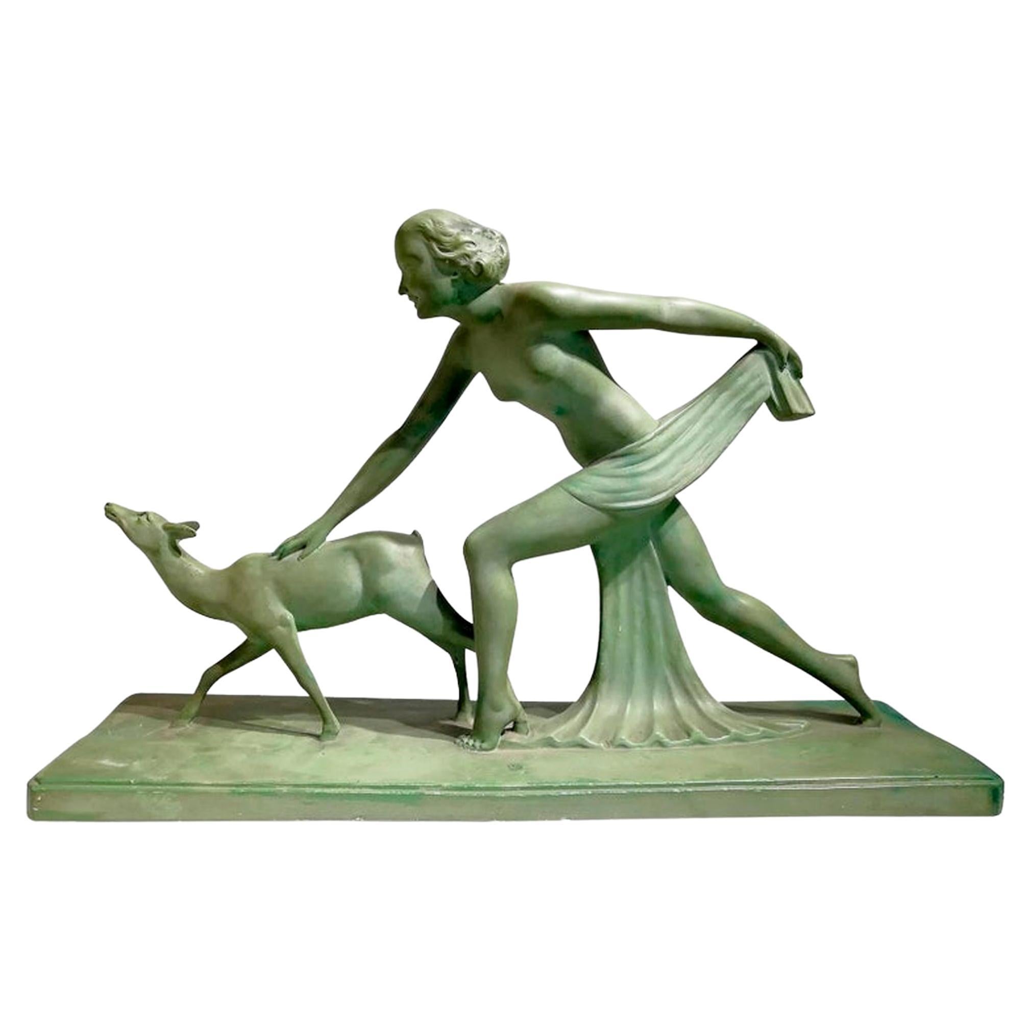 Bellissima scultura in terracotta verde firmata "S.Melanie", circa 1920