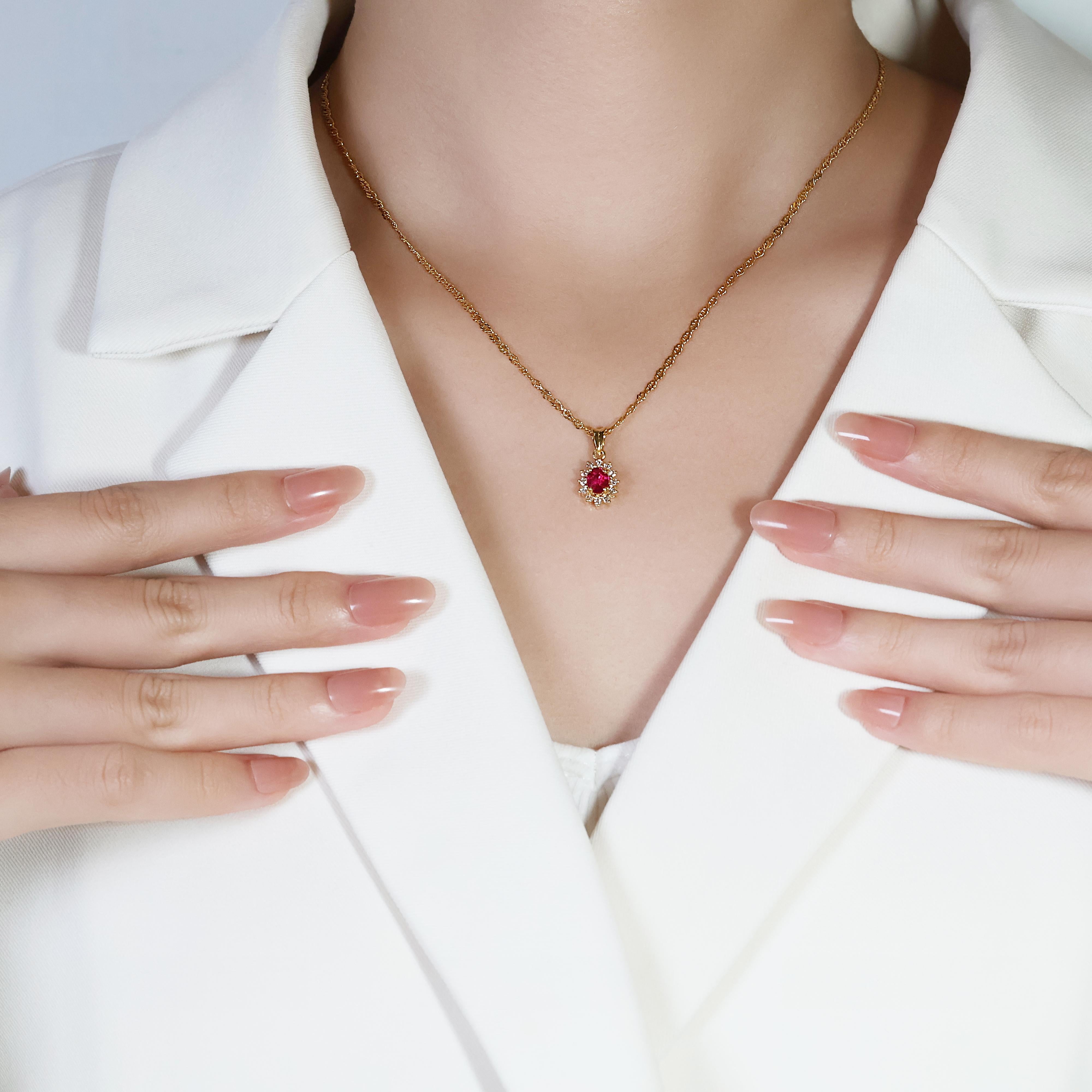 This exquisite 18K yellow gold necklace features a 0.50ct oval pink sapphire as the centerpiece, surrounded by 12 round brilliant diamonds with a total carat weight of 0.18ct, graded G in color and VS in clarity. The harmonious combination of the