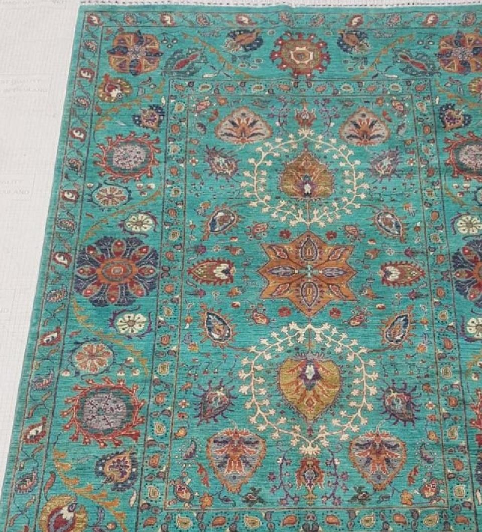 Beautiful One of a Kind handmade hand knotted Woolen Rug. This large area rug is composed of finest quality handspun virgin Merino wool. on a cotton base.  Handmade in Afghanistan, there is an abundance of flowers, leaves and Boteh patterns. Colour