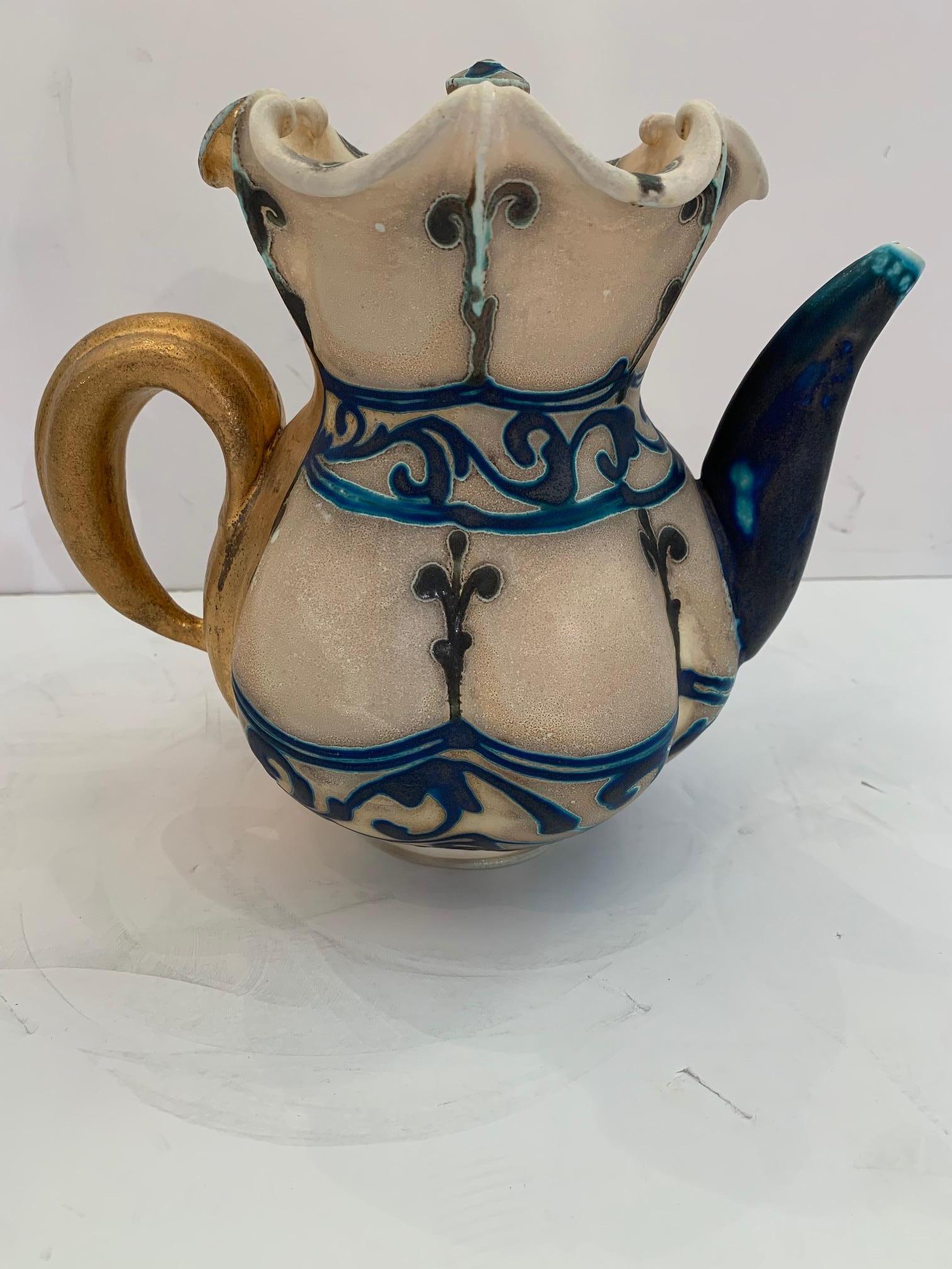 A beautiful original tea pot with lid and 2 pouring vessels and saucers by Julia Galloway Pottery, Montana.
Measures: Pitcher 10.5 W x 9 H x 7 D
Cup 5.75 W x 4 H x 4.25 D
7.5 diameter saucer 1.5 height.

 