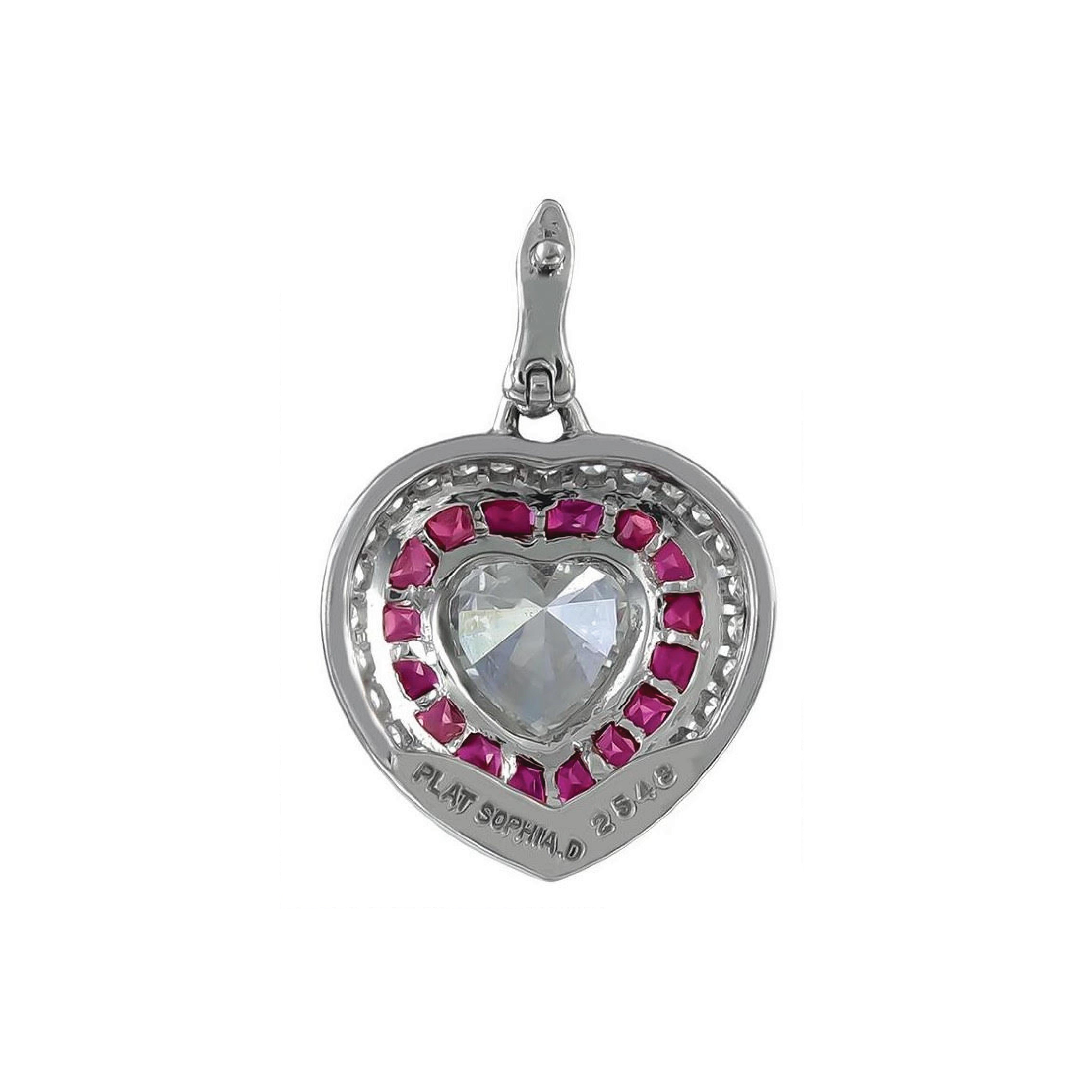 Gorgeous Art Deco inspired platinum set pendant by Sophia D. consisting of a 0.80 carat heart shaped diamond in the center and French cut rubies weighing 0.63 carats along with 0.32 carats of Diamonds. 

Sophia D by Joseph Dardashti LTD has been