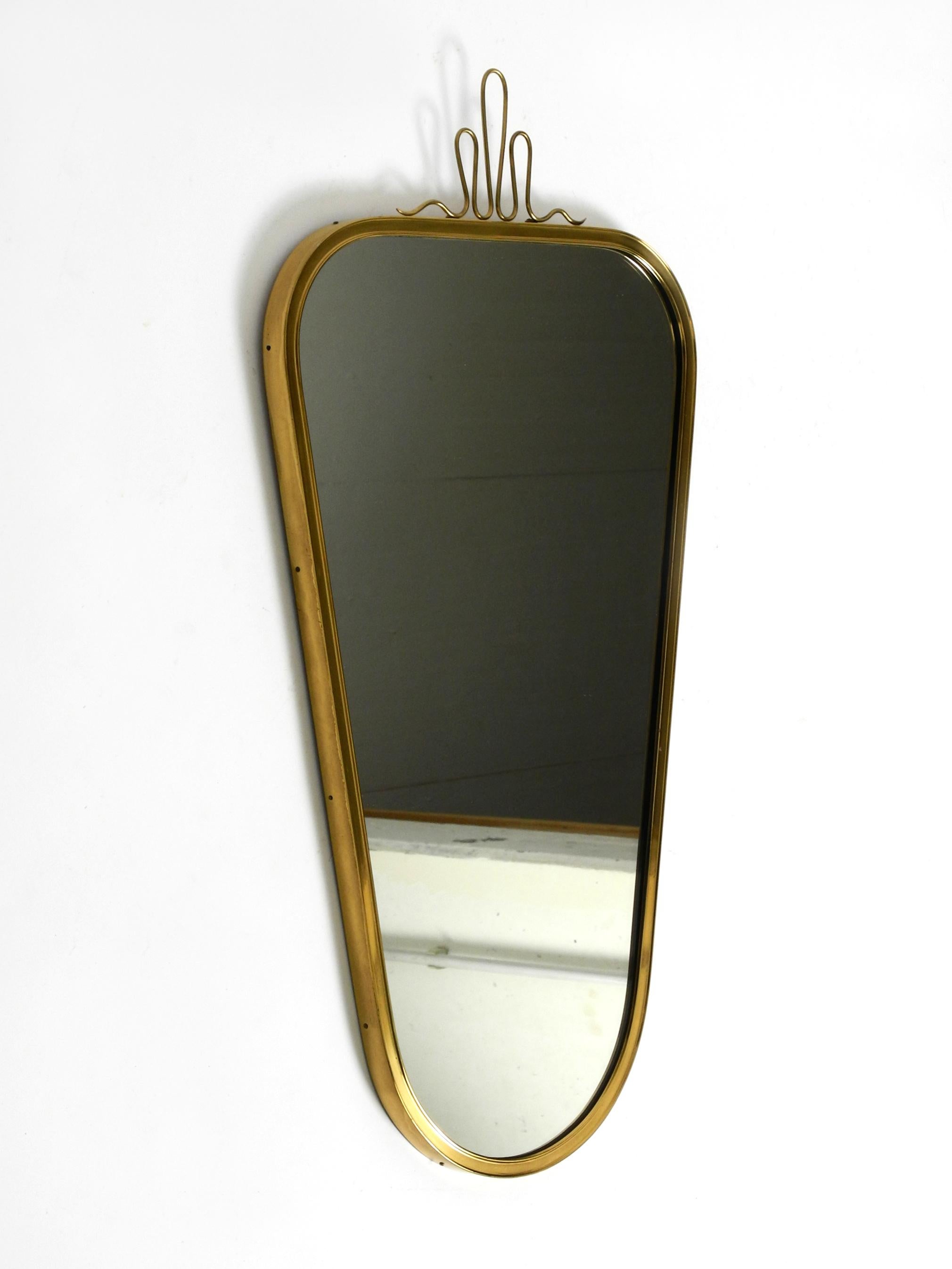 German Beautiful heavy Mid Century Modern brass wall mirror from Münchner Zierspiegel