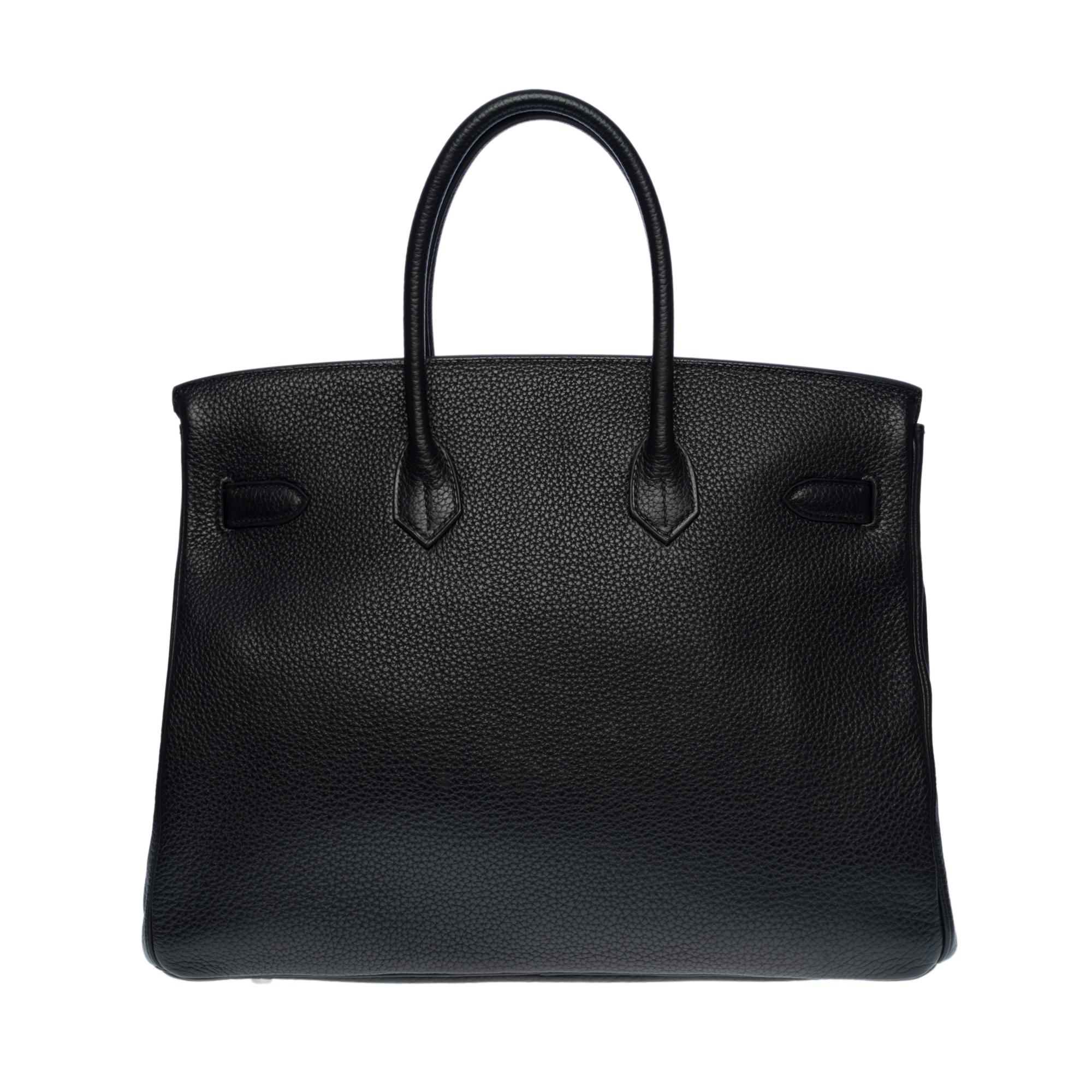 Splendid Hermes Birkin handbag 35 cm in black Togo leather, palladium silver metal hardware, double black leather handle allowing a hand-carried

Flap closure
Black leather lining, one zippered pocket, one patch pocket
Signature: 