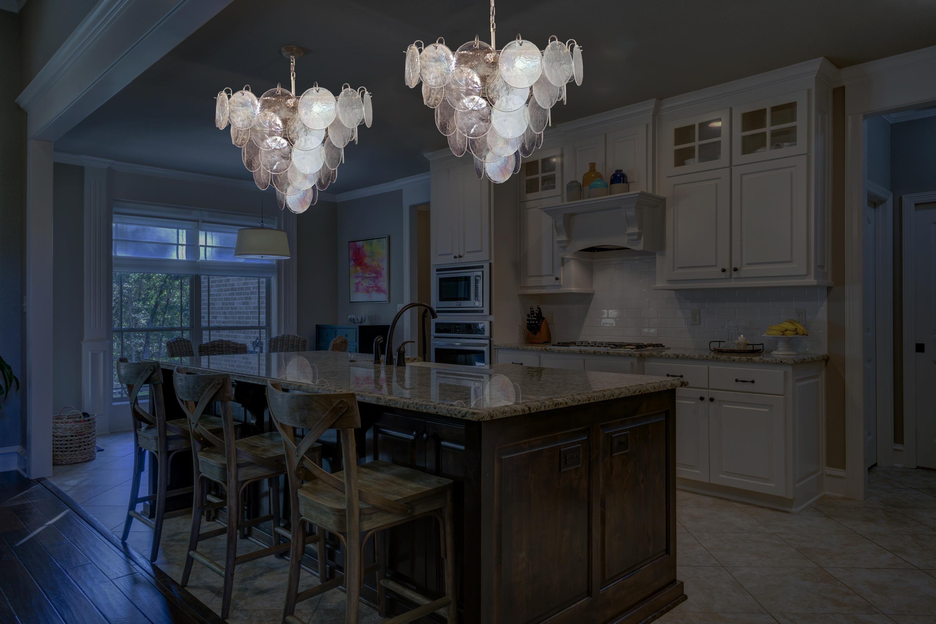 Italian Murano chandeliers. Each chandelier has 57 Murano iridescent glass disks. The glasses are now
unavailable, they have the particularity of reflecting a multiplicity of colors, which makes the chandelier a true work of art. Nickel metal