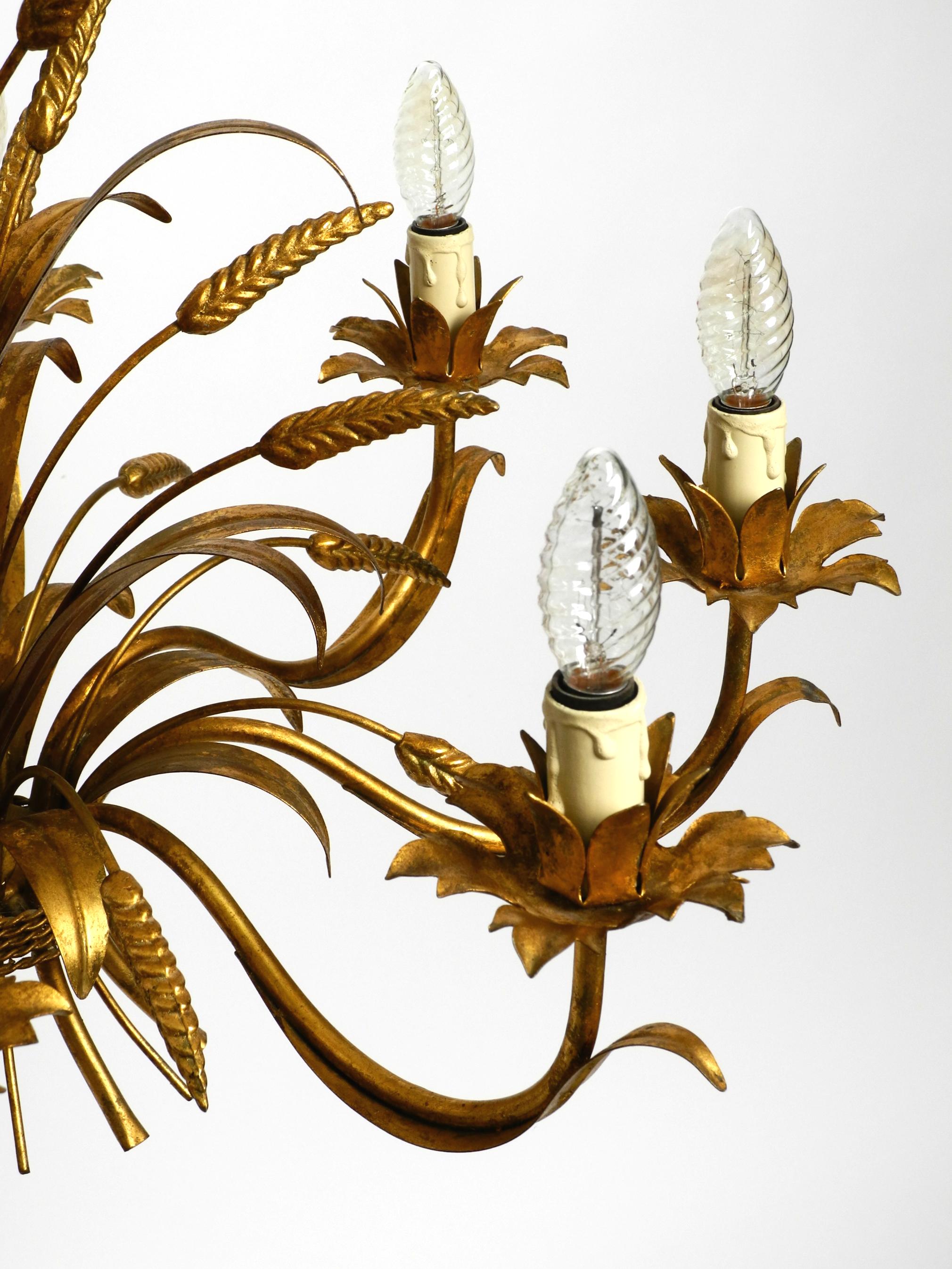 Metal Beautiful huge 70s gold-plated 8-arm metal chandelier by Hans Kögl For Sale
