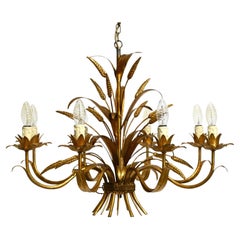Magnifique lustre à 8 branches en métal doré des années 70 par Hans Kögl