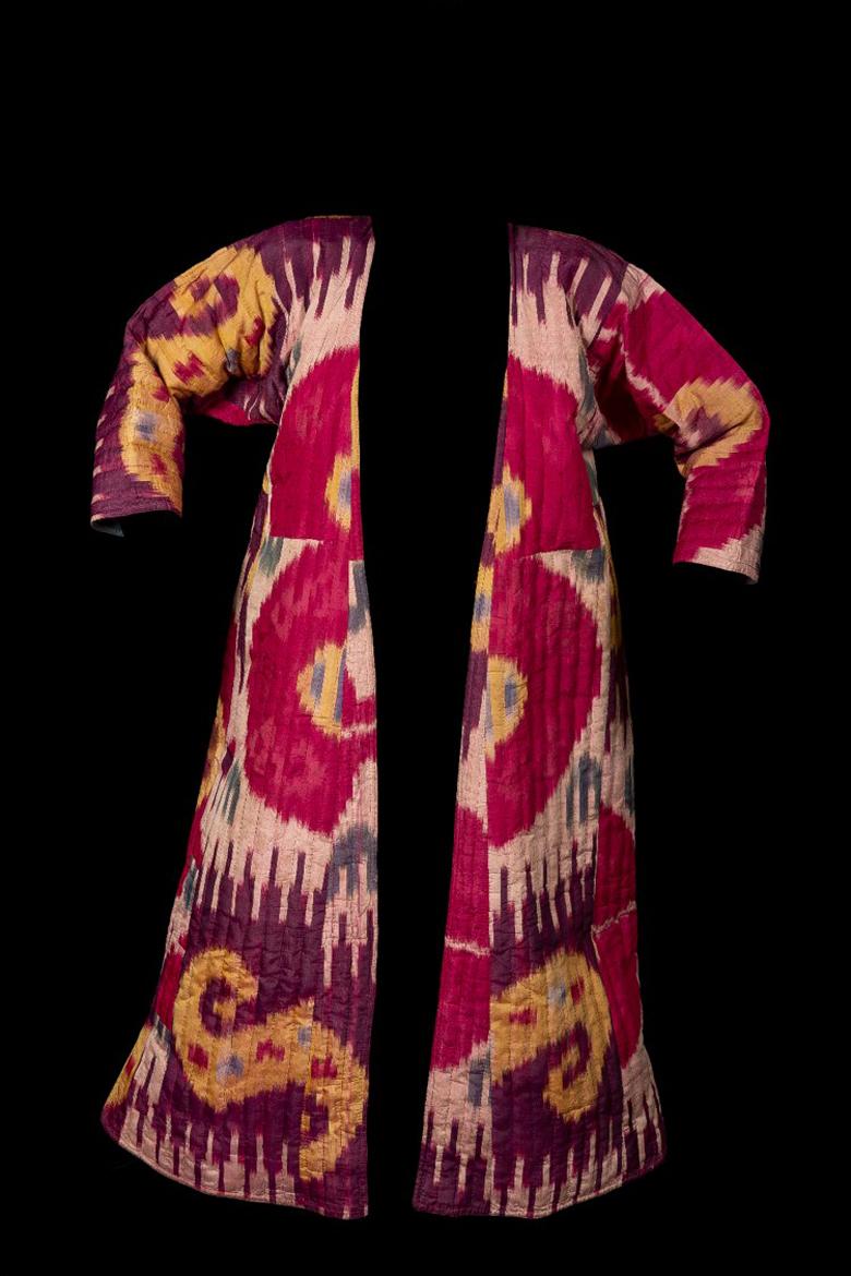 A beautiful Ikat Munisak – a woman’s uzbek robe – in traditional pomegranate design symbolizing fertility. It has a square patch in Magenta with a flower motif.

Ca. 19th Century

Ikat weaving has emerged from different parts of the world