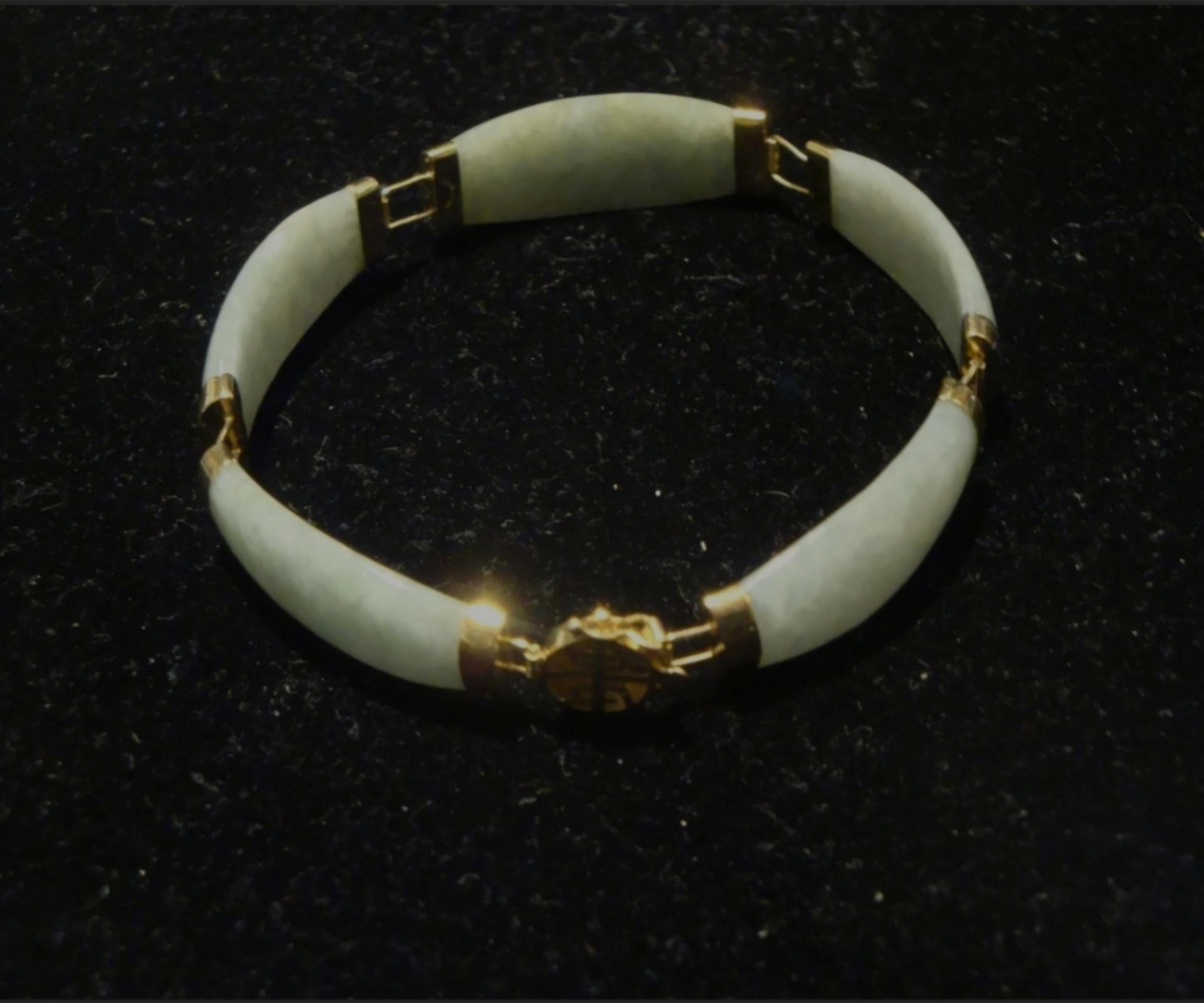 The Following Item we are Offering is a LOVELY BEAUTIFUL Natural Green Jade Bangle Bracelet mounted with 14KT Gold Bars and Clasp with Beautiful Color!! 
Measurements: 7 1/2