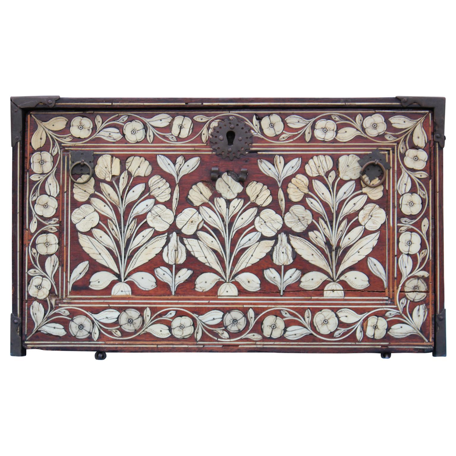 Stunning bone-inlaid box. Box has hinged drop-front opening to reveal nine drawers. Can be used decoratively, for jewelry, make-up, or medicine. Some missing pieces will need repair.

17th-18th century.