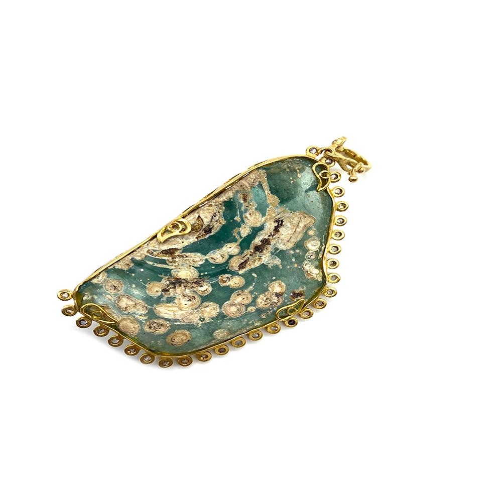 Antiquity 20 Karat Yellow Gold Pendant with 1.12 Carat Rose-Cut Diamonds, Antique Roman Glass, and Iridescent Patina. The Pendant Exhibits High Color Saturation and Translucency Due To The Natural Elements Of The Ancient Roman Glass and Patina.