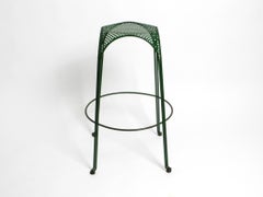 Italian 1960s bar stool made of green painted metal with perforated metal seat