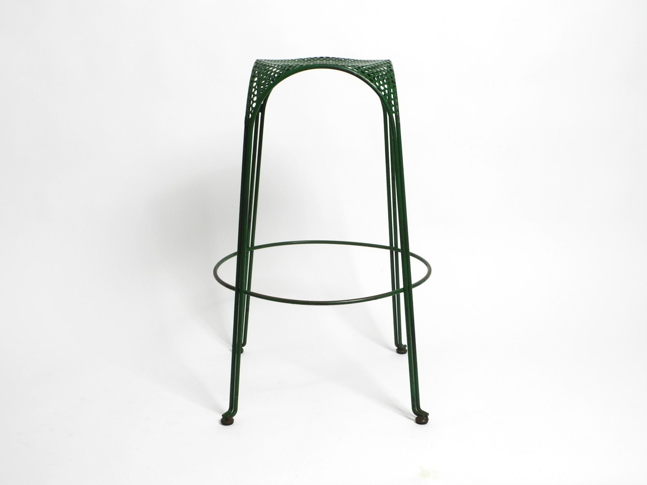 Space Age Italian 1960s bar stool made of green painted metal with perforated metal seat For Sale