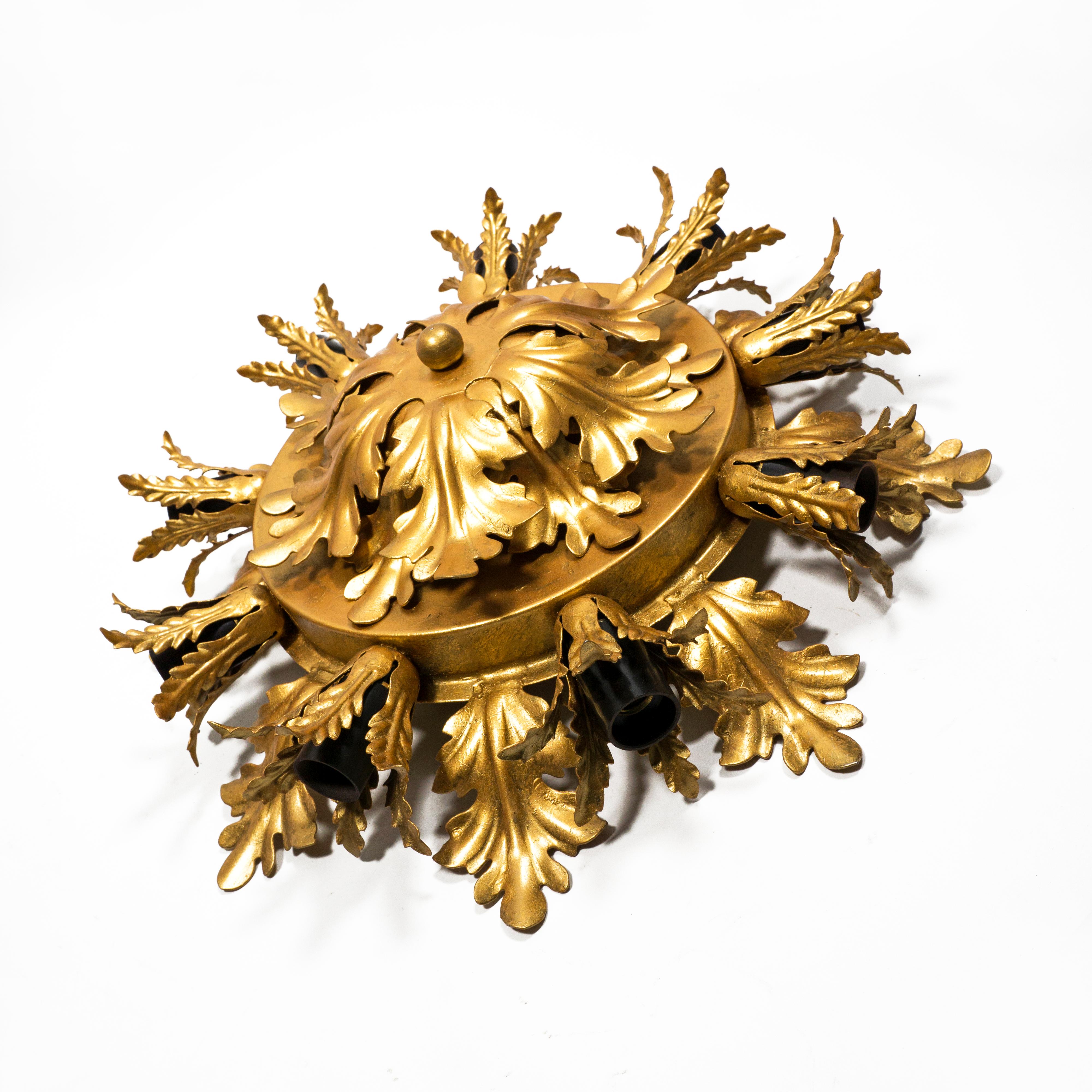 Hollywood Regency Mid Century Banci Firenze Ceiling Lamp  Wall Lamp from the 1970s.
This beautiful, large Florentine lamp consisting of many gilded leaves and a central flower and creates a very pleasant light. The lamp captivates with the natural