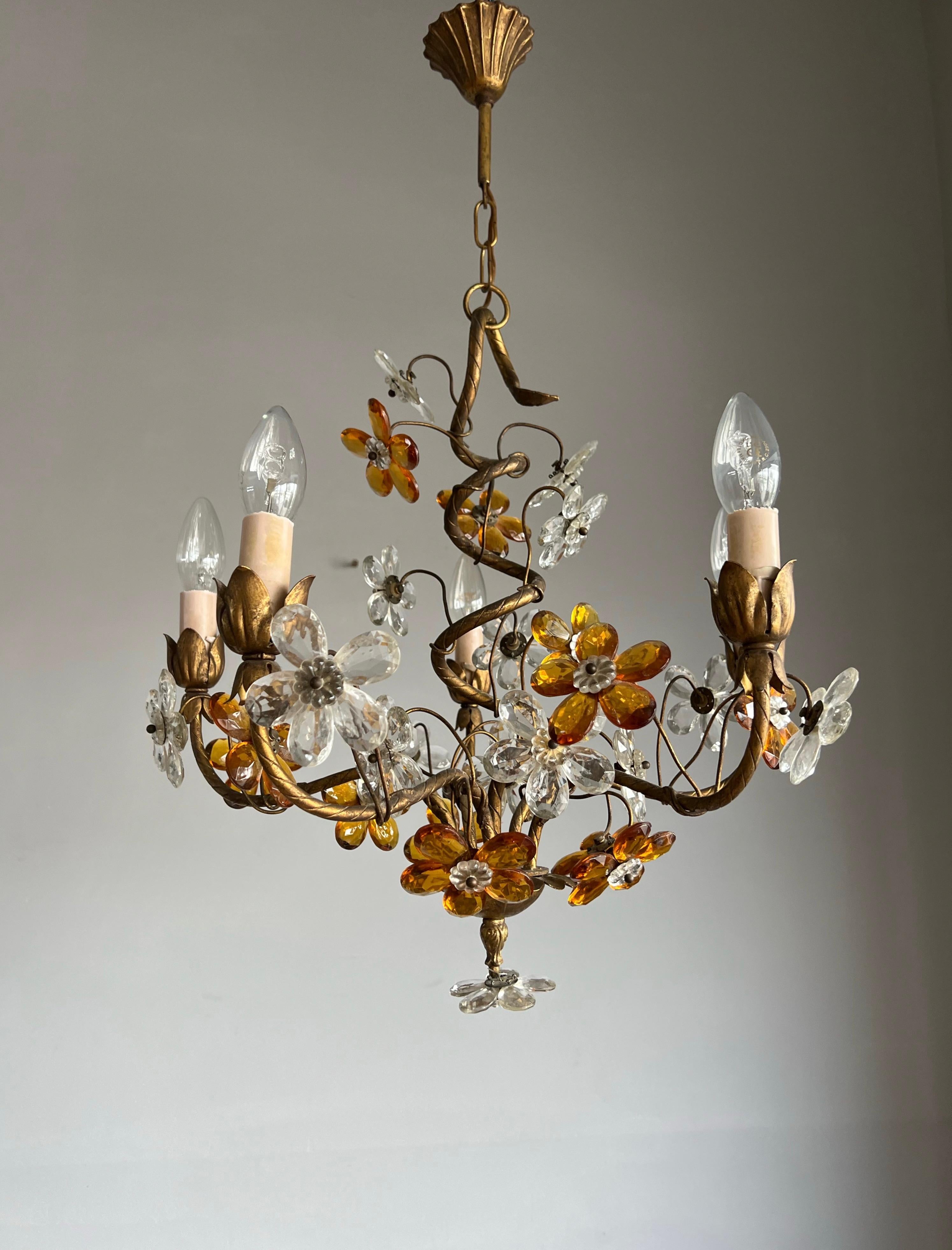 Stunning design, hand-crafted in Italy, modern art glass pendant light with glass flowers.

This incredibly well designed and beautifully executed chandelier is in mint condition. This quality made and finely hand-crafted gilt metal and mouth blown