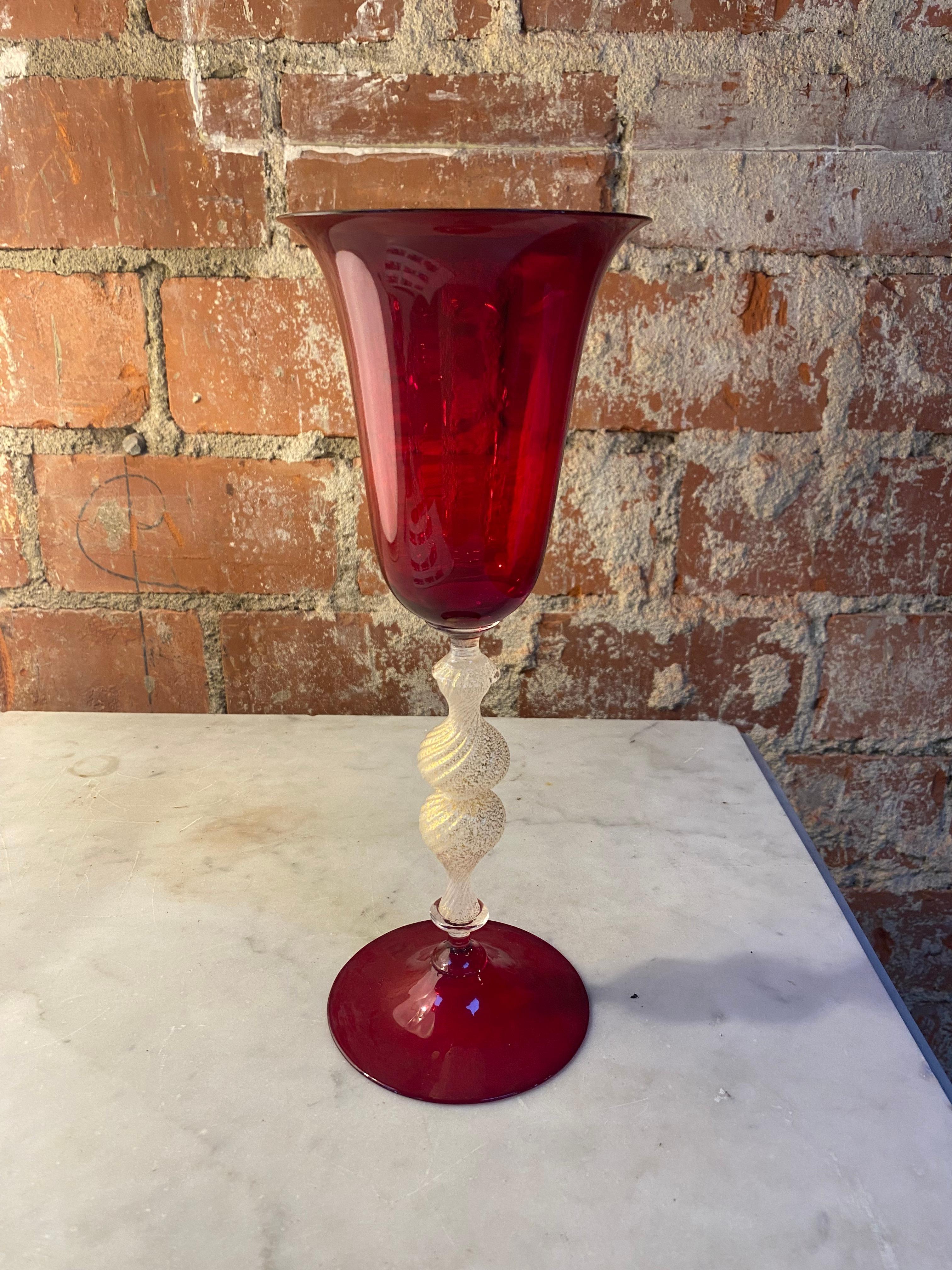 Beautiful Italian handcrafted chalice in blown Murano glass red color, 1970s
This elegant chalice is rich in lovely details that add harmoniously to its grace.