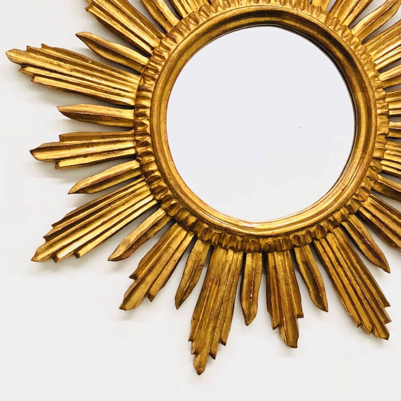 A gorgeous starburst mirror. Made of gilded wood. No chips, no cracks, no repairs. It measures approximate 22 7/8