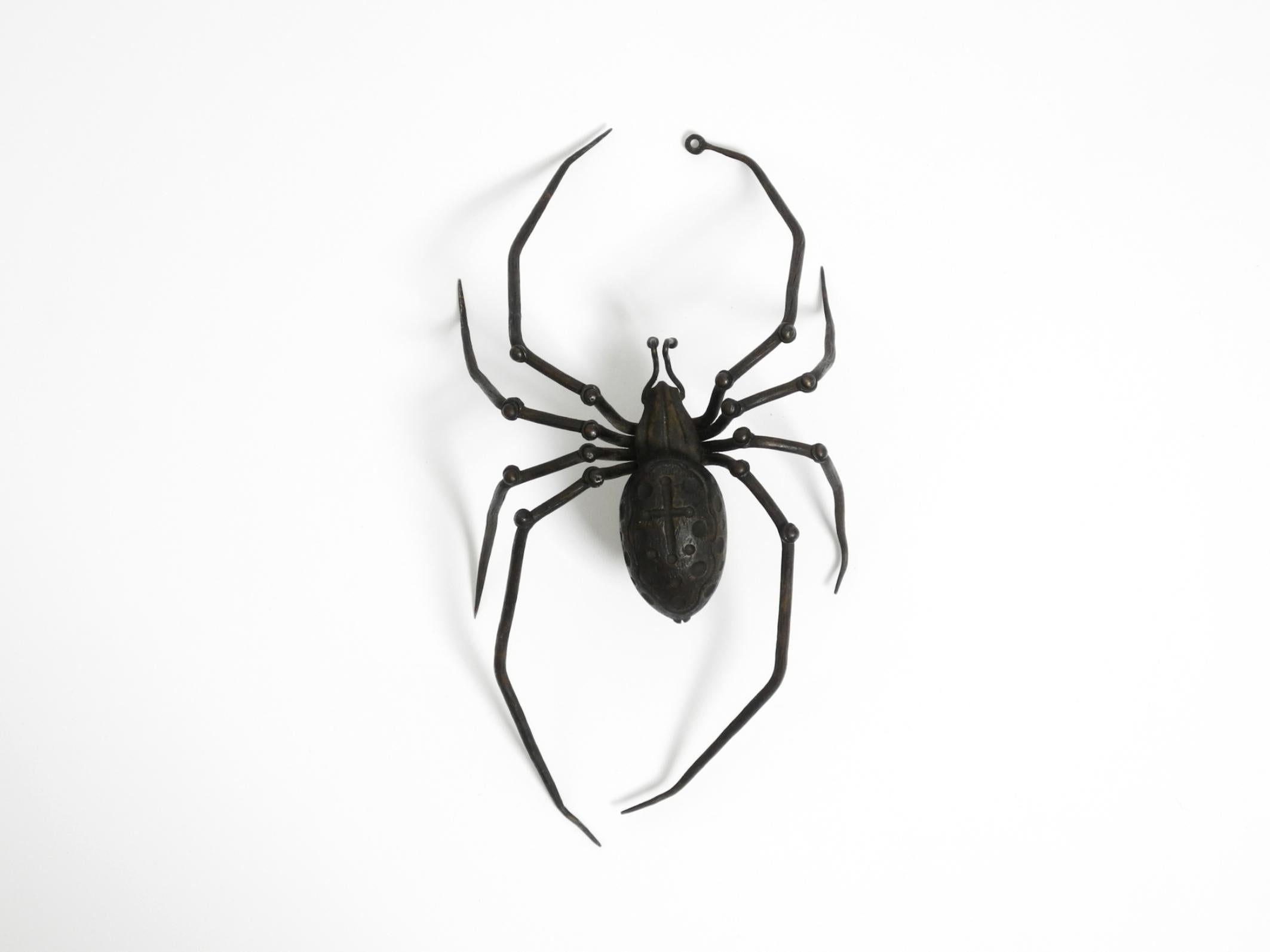 Beautiful Italian Mid Century Modern wall decoration in the shape of a black iron spider.
In Italy, spiders are considered lucky charms.
Typical Italian mid-century design in very beautiful original condition.
Highly detailed and in 100% original