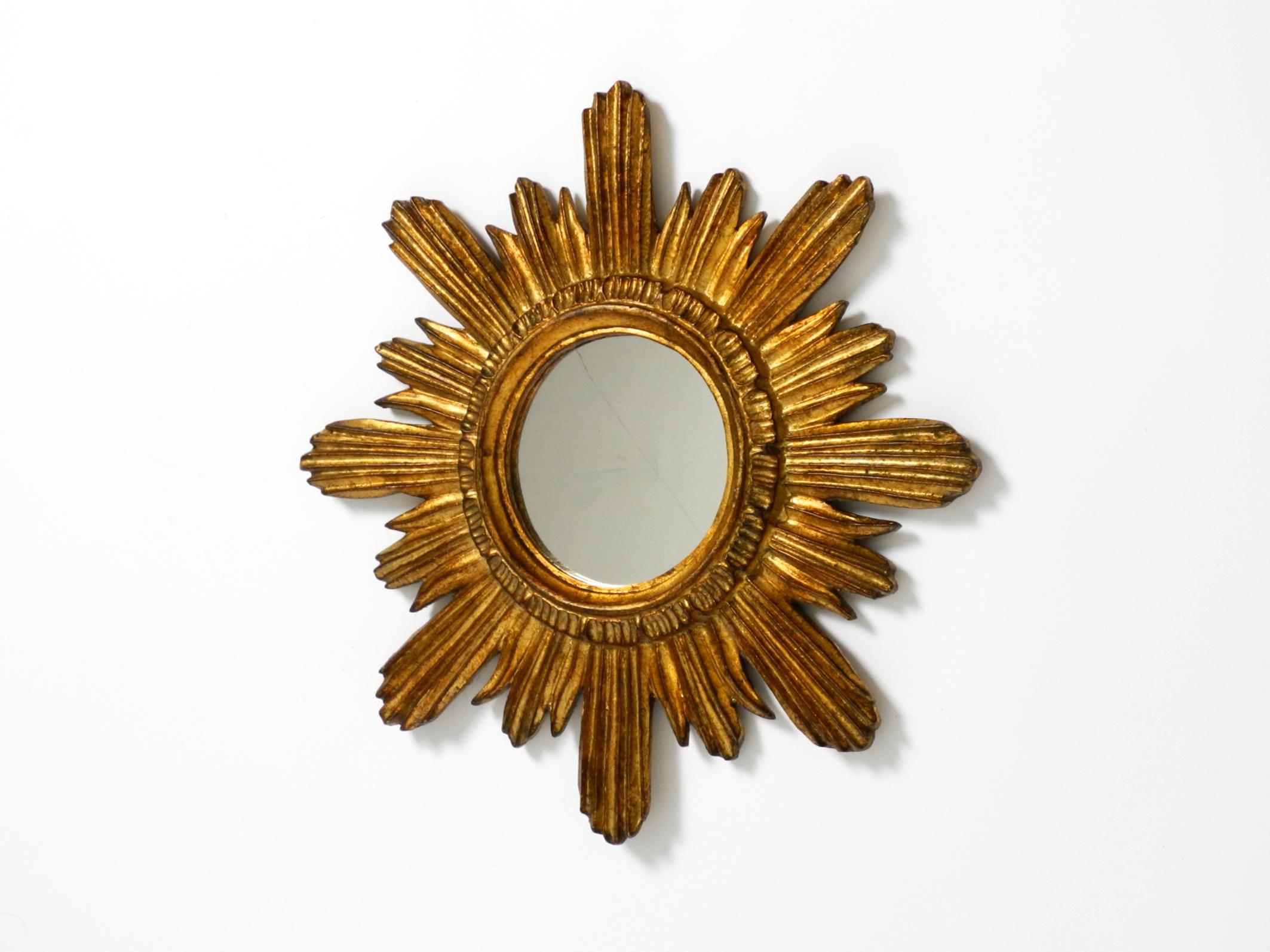 Mid-Century Modern Beautiful Italian Mid Century Sunburst wall mirror made of wood gold plated For Sale