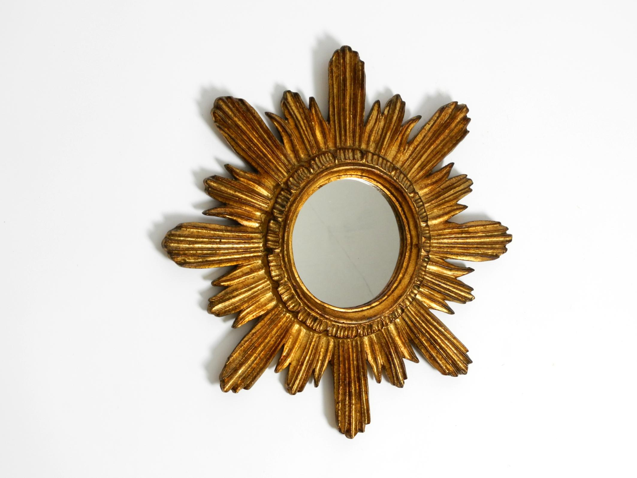 Mid-20th Century Beautiful Italian Mid Century Sunburst wall mirror made of wood gold plated For Sale