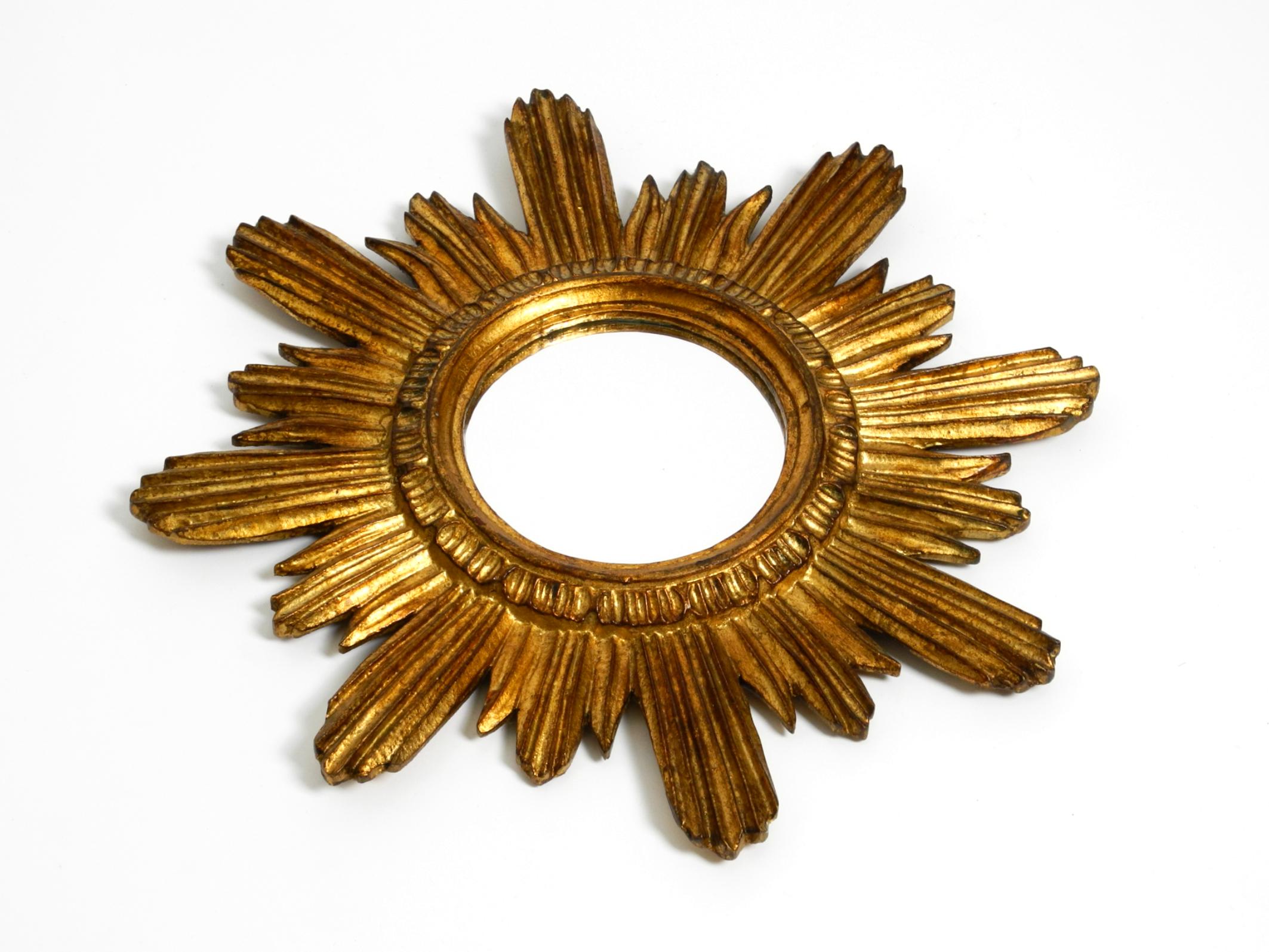 Mirror Beautiful Italian Mid Century Sunburst wall mirror made of wood gold plated For Sale