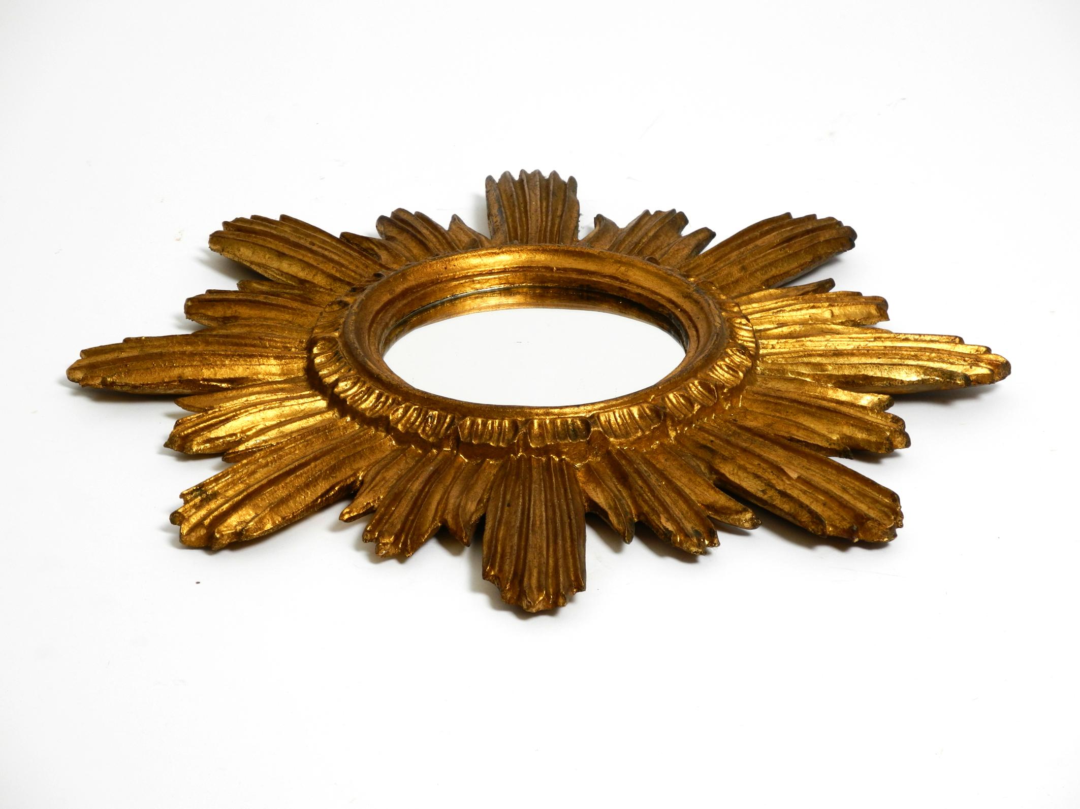 Beautiful Italian Mid Century Sunburst wall mirror made of wood gold plated 1