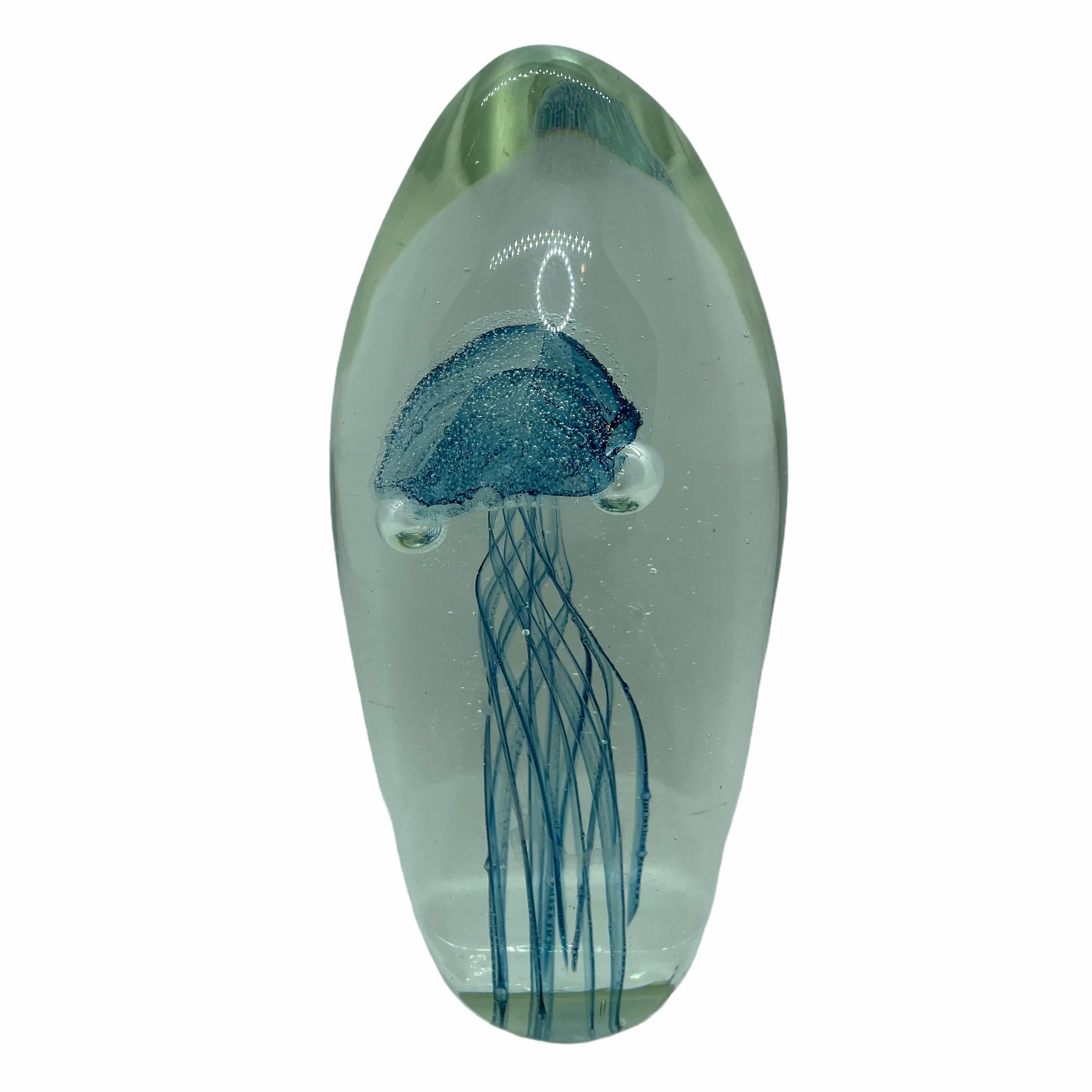 Beautiful Murano hand blown aquarium Italian art glass paper weight. Showing a jelly fish, underwater floating on controlled bubbles. Colors are a turquoise and clear. A beautiful nice addition to your desktop or as a decorative piece in every room.