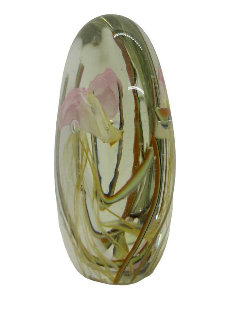 Beautiful Murano hand blown aquarium Italian art glass paper weight or sculpture. Showing a jellyfish, underwater floating on controlled bubbles in front of seaweed. Colors are a light pink, green,  yellow and clear. A beautiful nice addition to