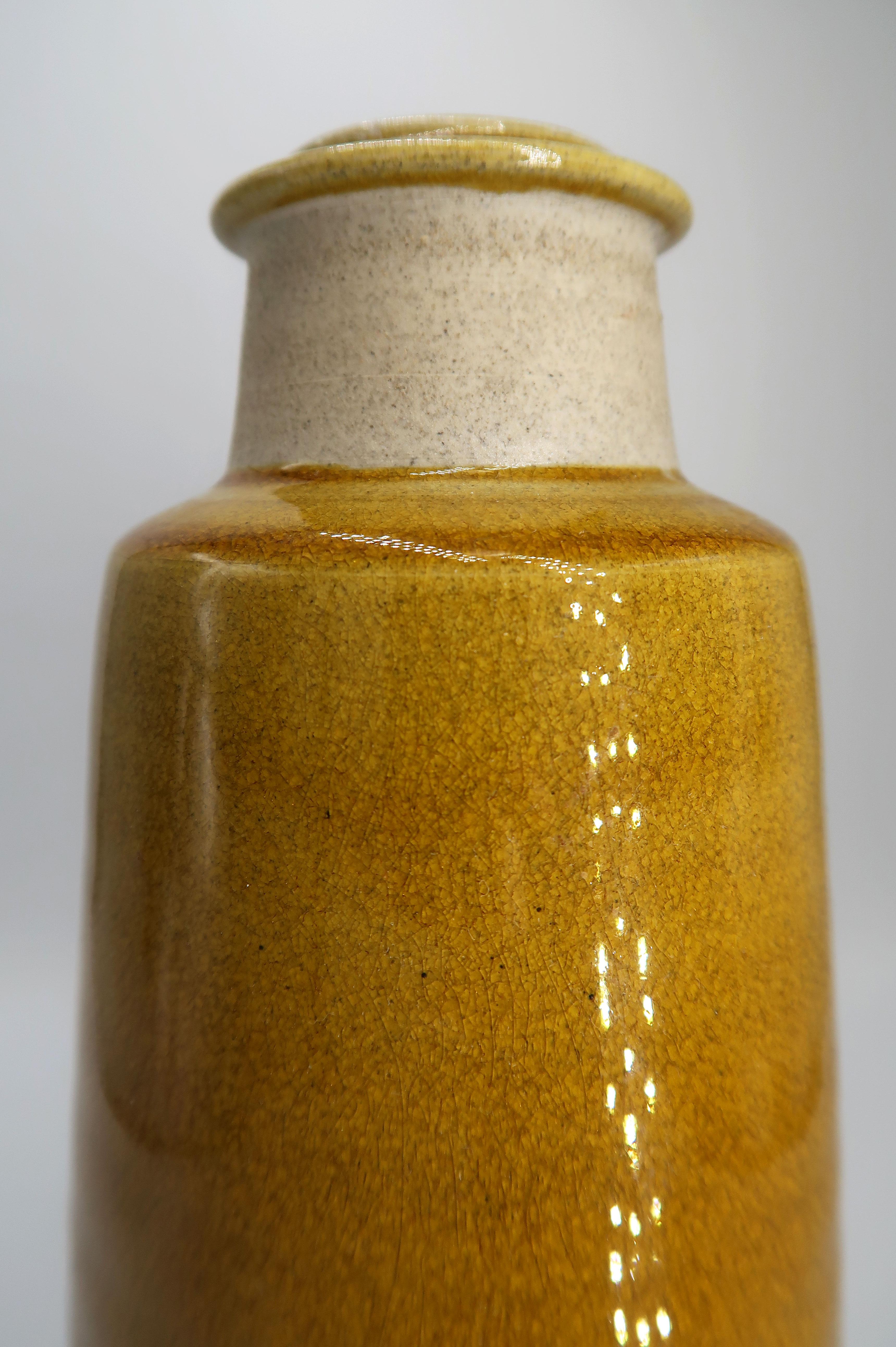 Stunning handmade Danish mid-century modern stoneware vase by Kähler. Raw neck with warm ochre shiny crackle glaze on the top and belly. Manufactured in the small Danish town of Naestved in the 1950s. Signed and stamped under base. A beautiful