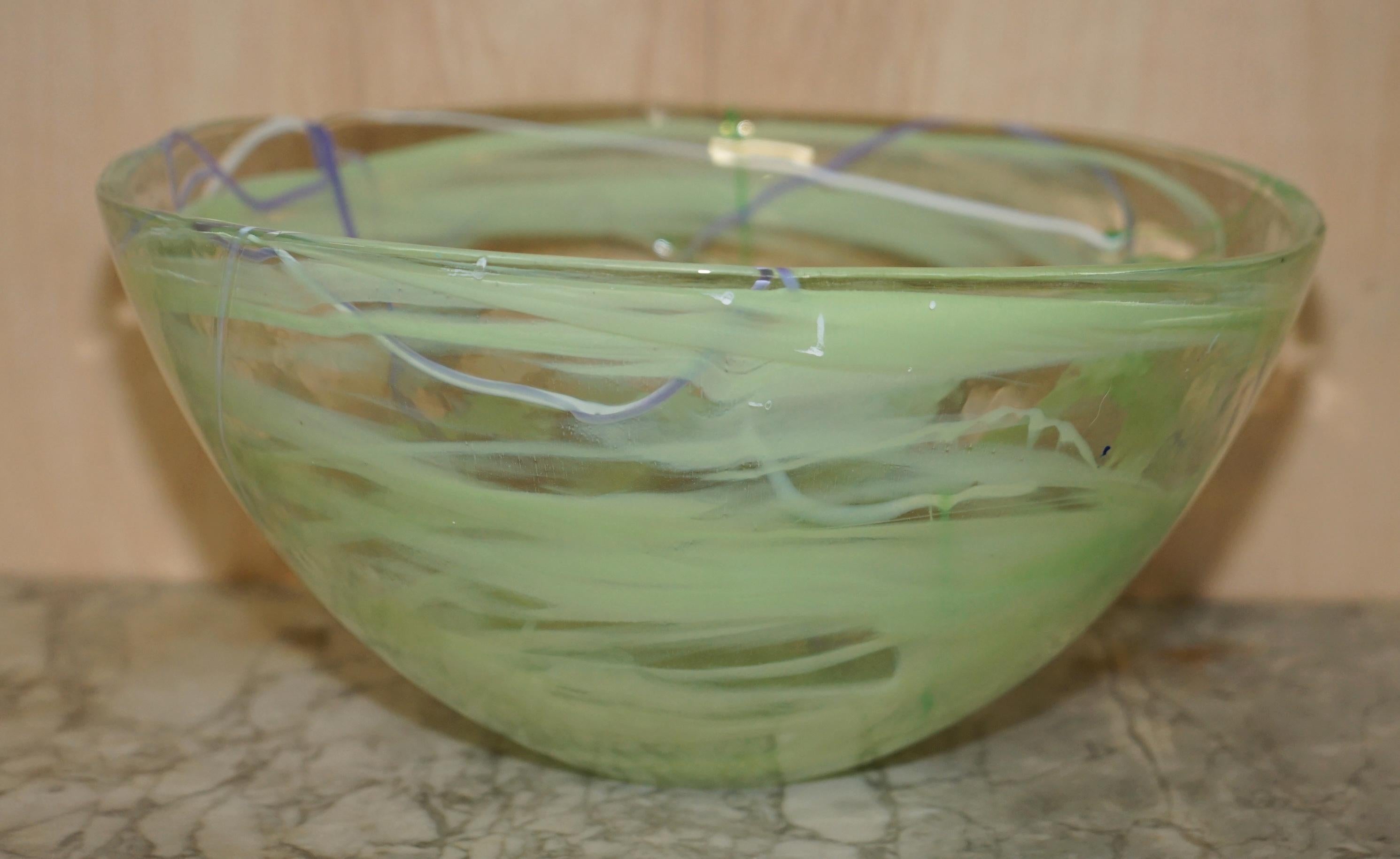 We are delighted to offer for sale this stunning decorative Anna Ehrner circa 1980's glass Kosta Boda large bowl.

This piece looks sublime from every angle, it doesn’t have any damage that I can see, it is very decorative and signed to the