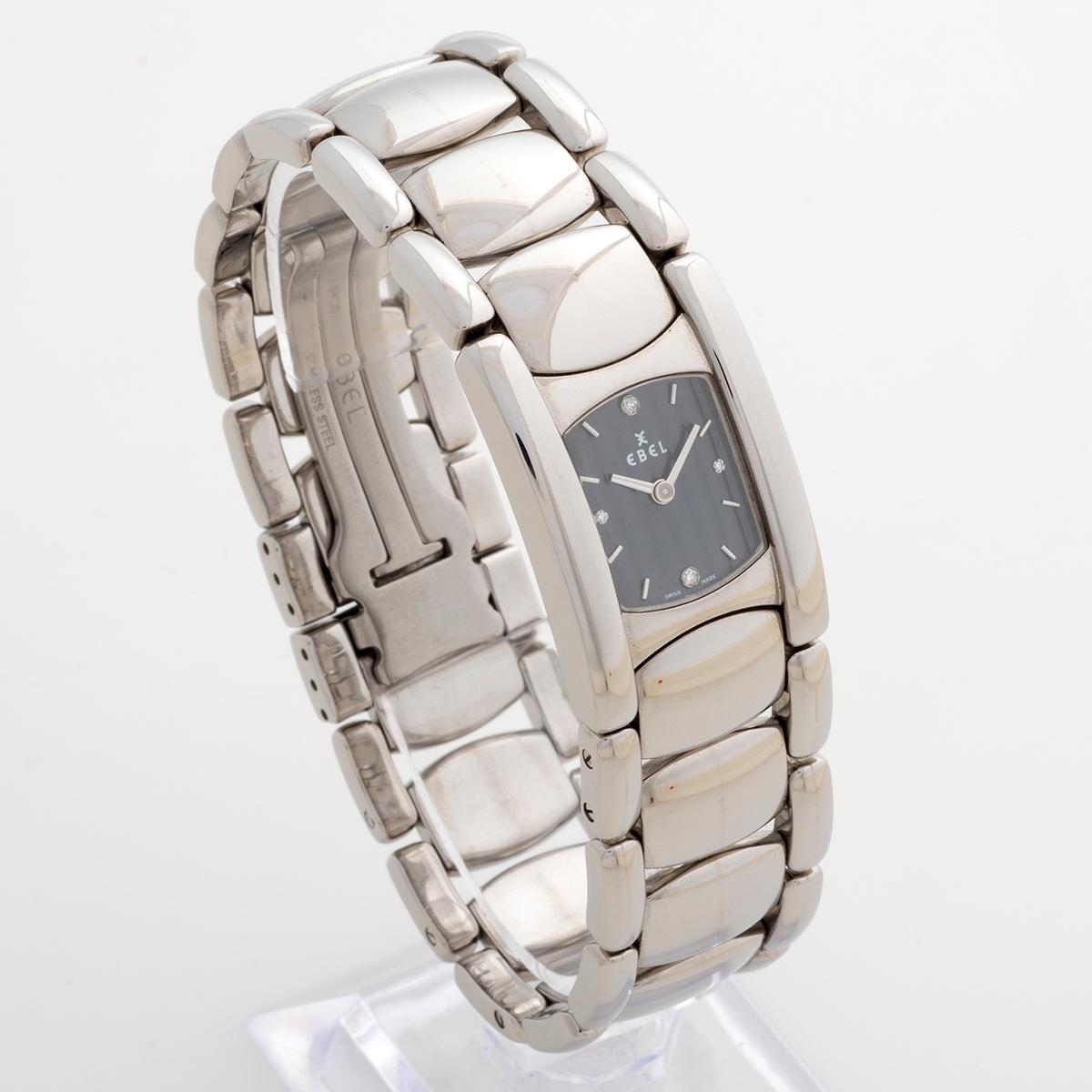 Our beautiful ladies Ebel Beluga Manchette, ref E9057A21 with quartz features a stainless steel case (20x 40mm) and bracelet with dark grey dial and factory diamond indices. Presented in outstanding condition with light signs of use from new, we