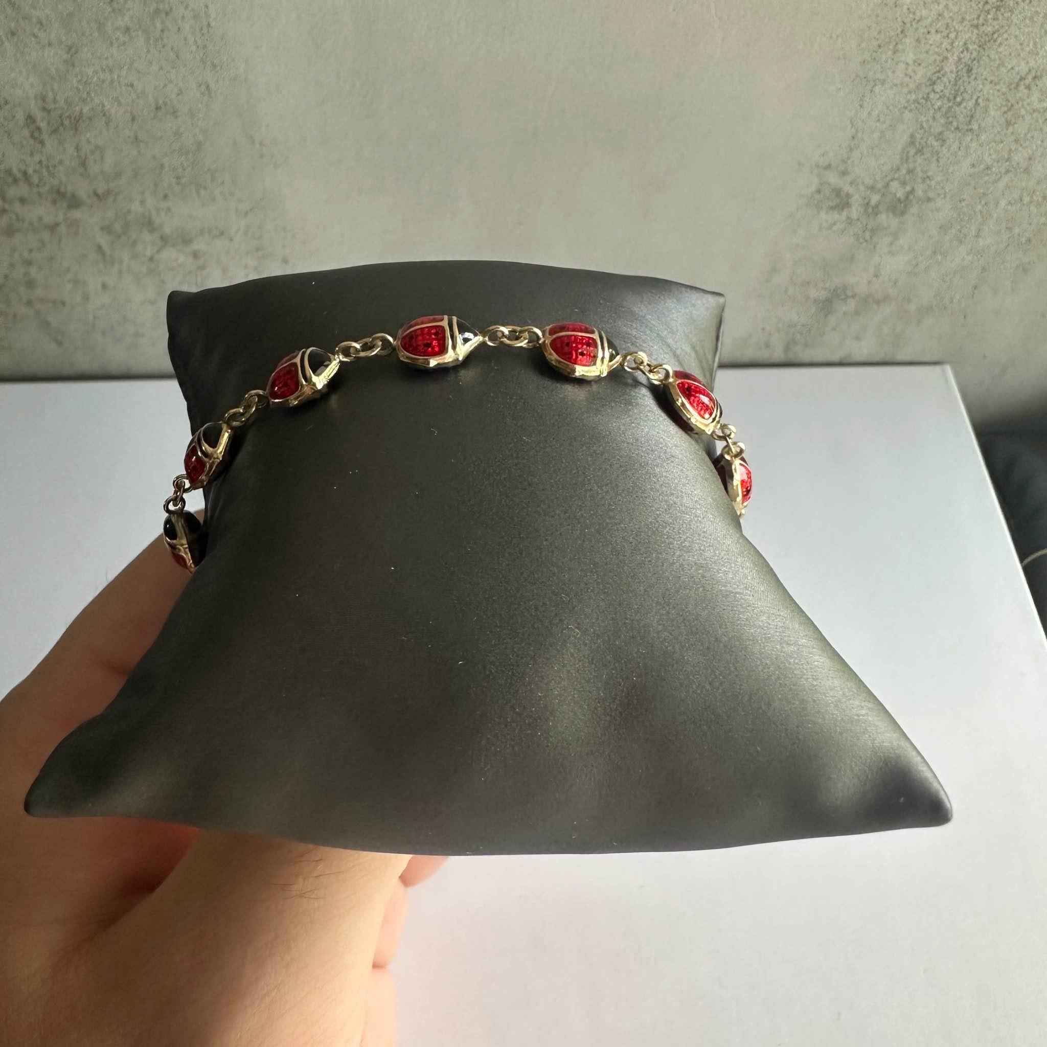 Add a playful and charming touch to your jewelry collection with this Beautiful Lady Bug Enamel Bracelet in 14kt Yellow Gold. Measuring 7.5 inches in length, this unique bracelet features exquisite ladybug enamel charms that add a delightful pop of