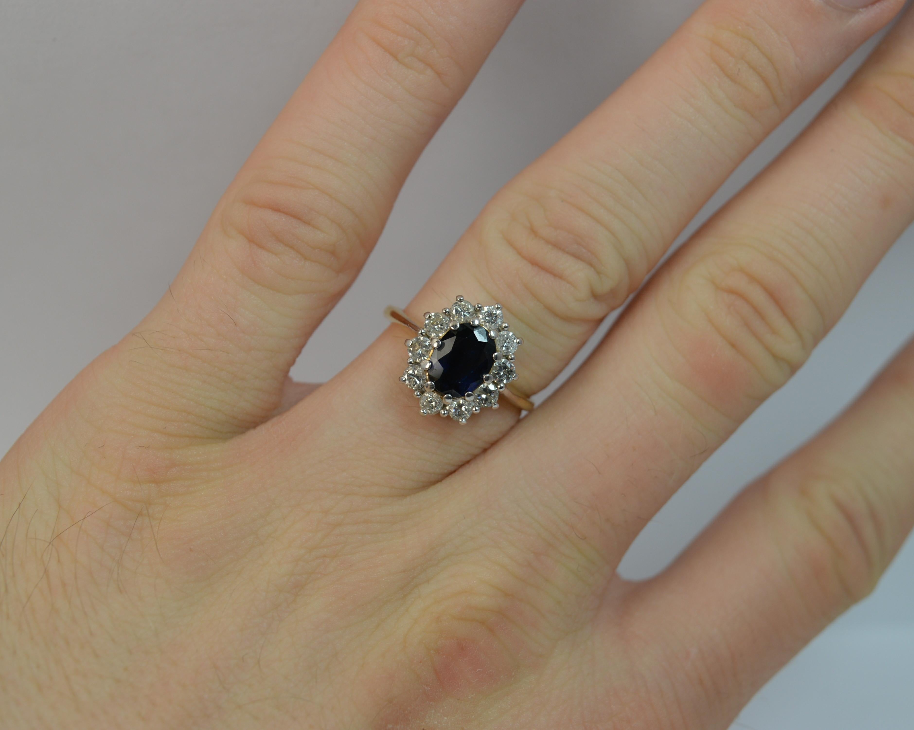 A beautiful Sapphire and Diamond ring.
SIZE ; N UK, 6 3/4 US and sizeable
Solid 18 carat yellow gold shank with white gold head.

Designed with a sapphire to the centre of superb dark clear blue colour. 5.7mm x 7.6mm approx. Surrounding are 10 round