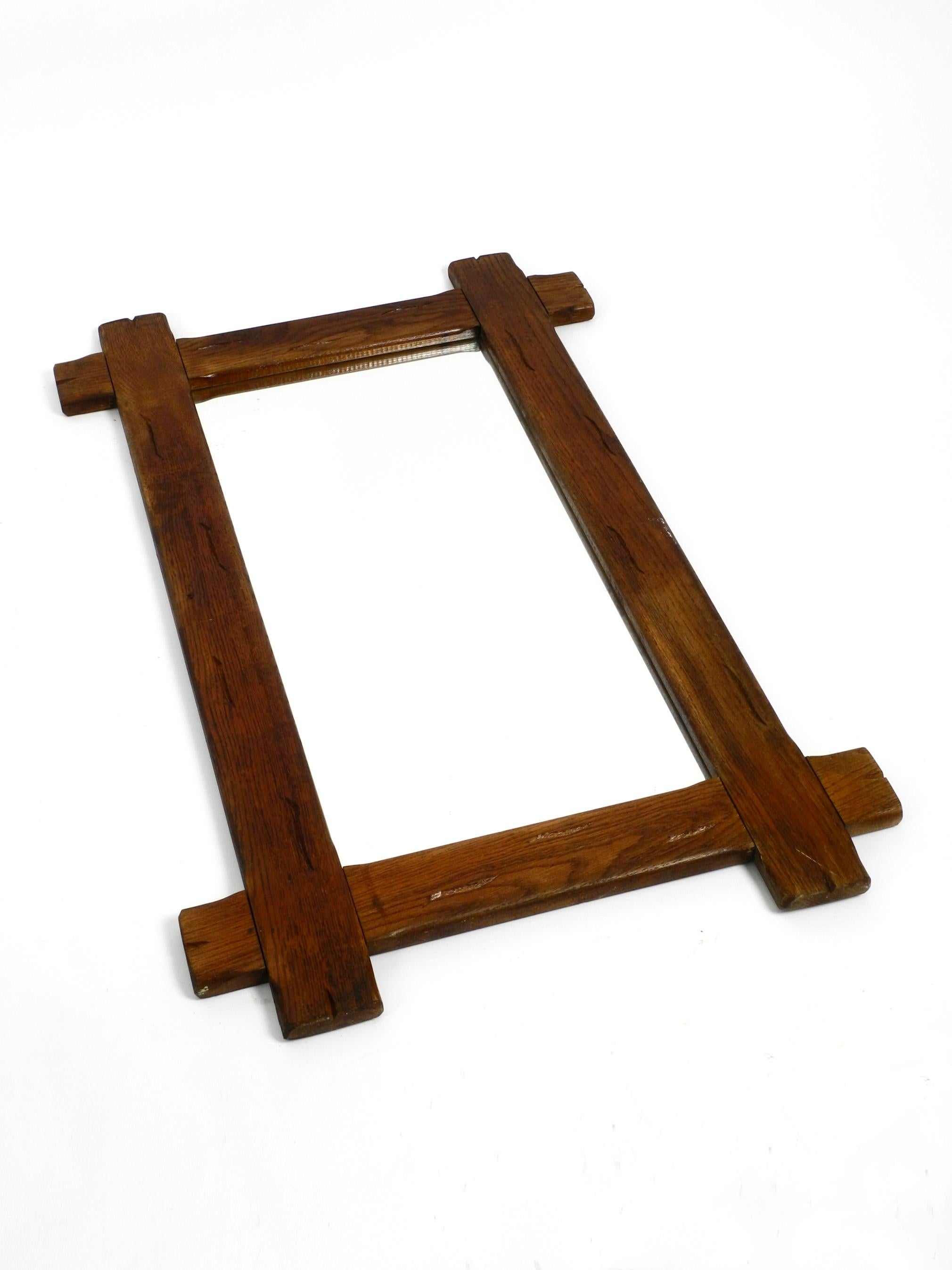 German Beautiful Large 1930's Wall Mirror with a Dark Solid Oak Frame For Sale