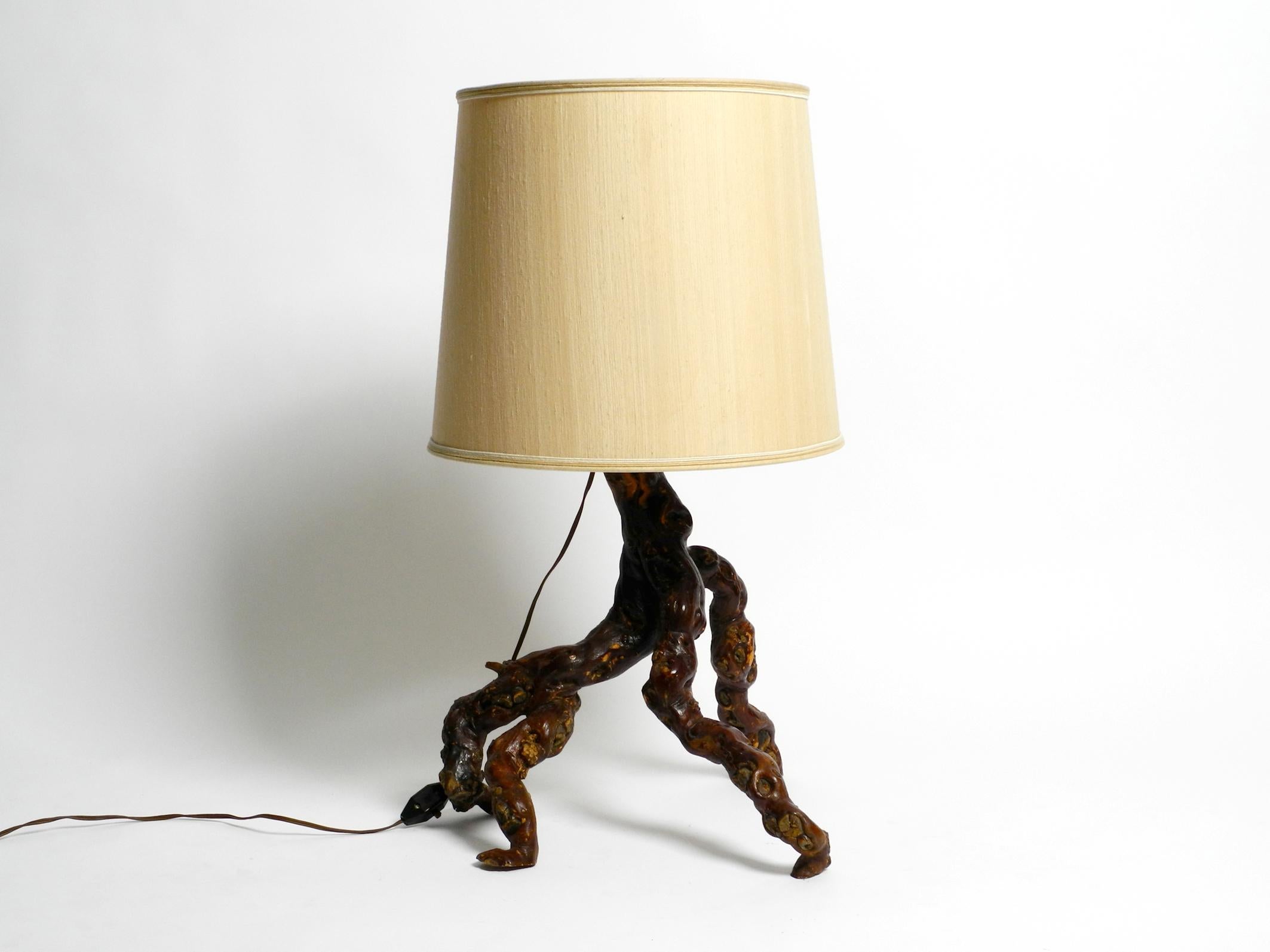 Beautiful large 1960's German root wood table lamp with a large silk shade
Typical mid-century design from Germany in very good vintage condition.
Complete lamp frame is made of a wooden root. Each lamp made of a root wood is unique.
100%