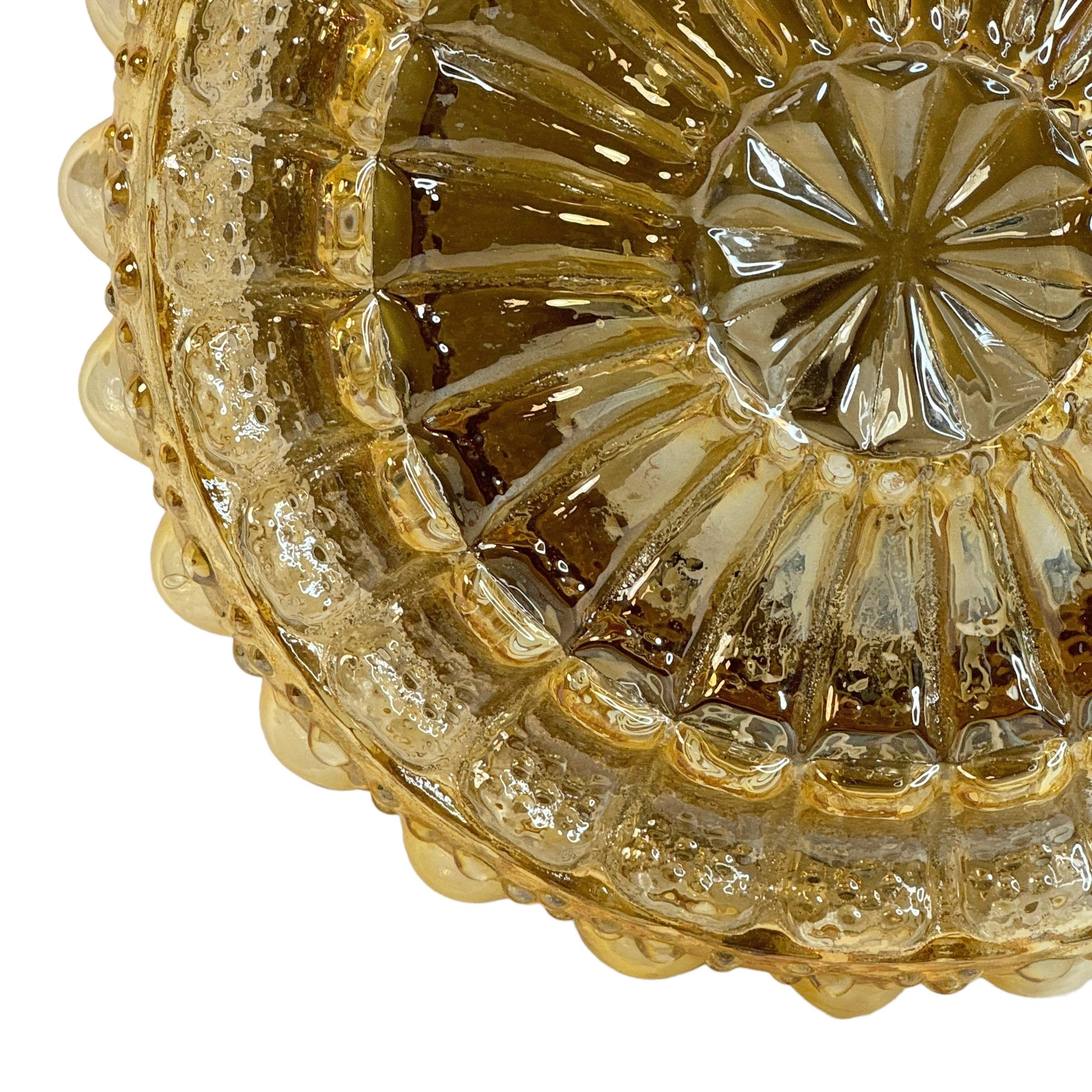Large bubble pattern amber glass flush mount. Made in Germany by RZB Leuchten. Gorgeous textured glass flush mount with metal fixture. The Fixture requires two European E27 / 110 Volt Edison bulb, up to 60 watts. Found at an estate sale in