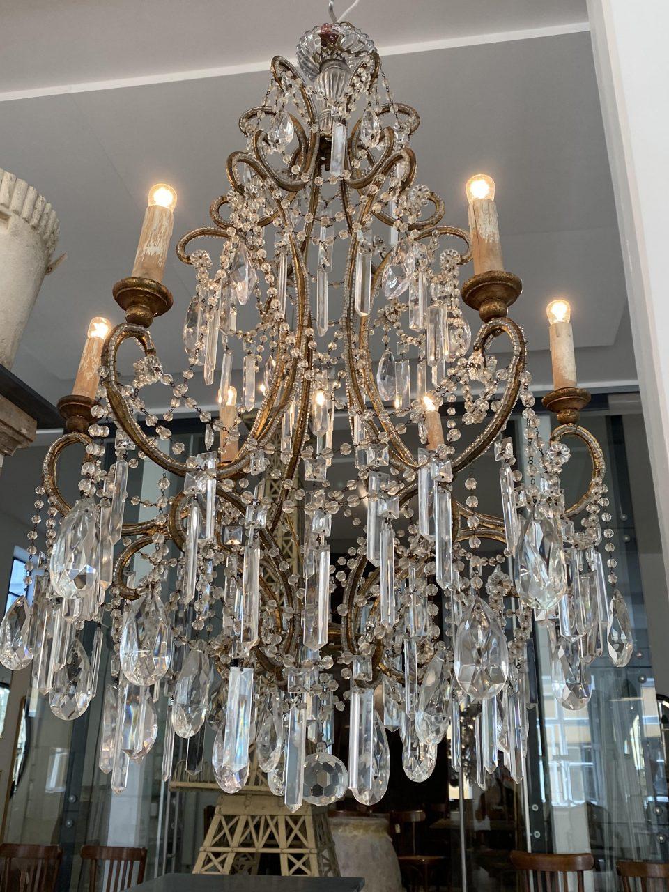 Elegant, imaginative and beautiful antique prism chandelier, circa 1900. Of the like one would see at French chateaus and mansions. Truly opulant clear rows of prisms wonderfully faceted ones, in different sizes that elegantly capture and reflect