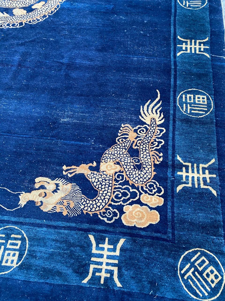 Late 19th century Chinese rug with a beautiful design with dragons and blue and yellow colors, entirely and finely hand knotted with wool velvet on cotton foundation.
