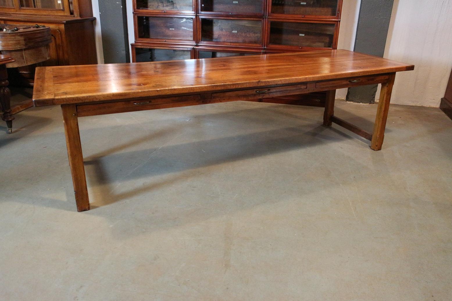 Beautiful large antique French country dining room table in perfect condition. What you see a lot about French tables is that different types of wood have been used, this table is made of walnut with a beautifully patina and the base of cherry wood