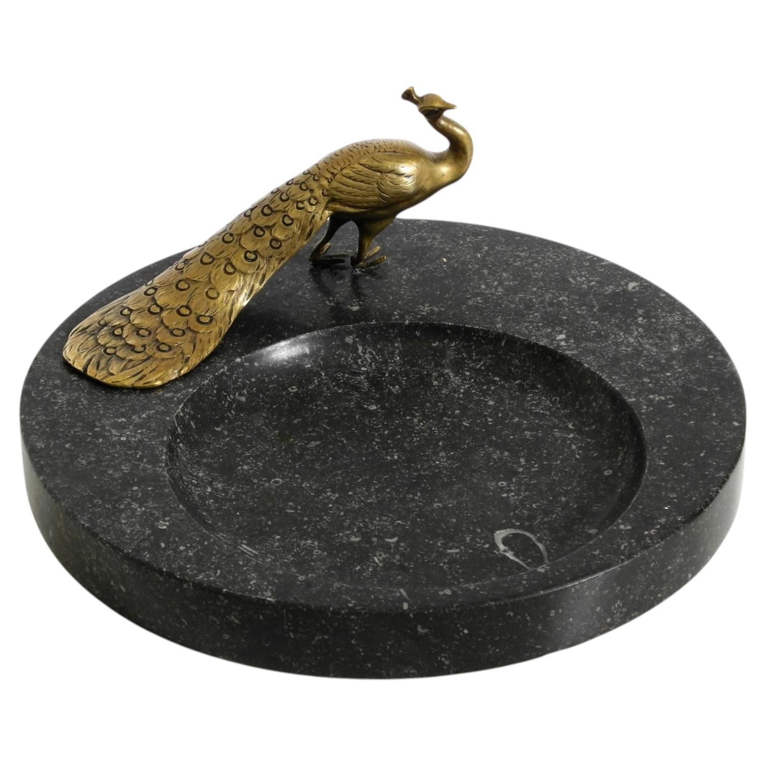 Beautiful, large black granite valet tray featuring a brass peacock, circa 1920 For Sale