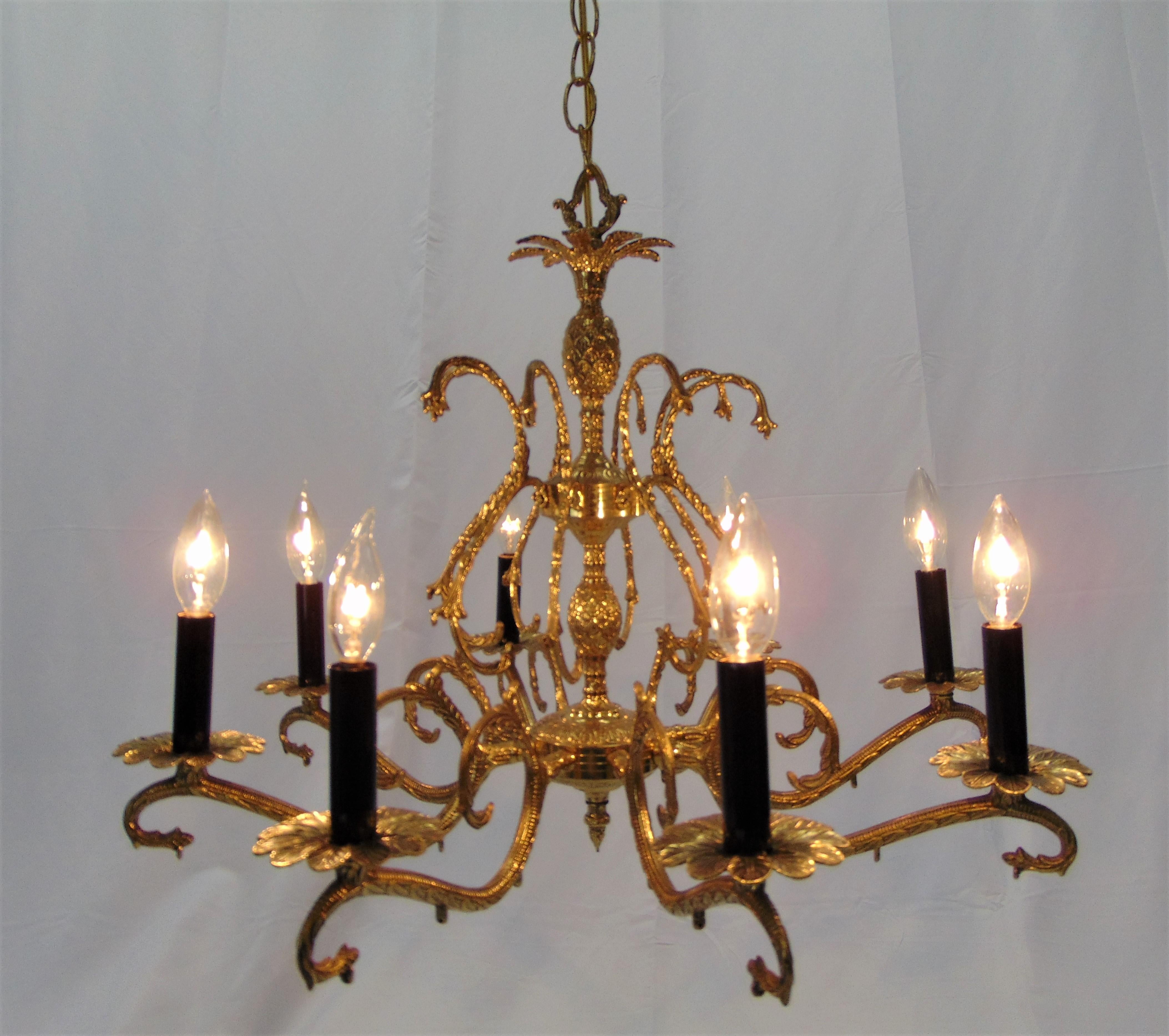 This is a gorgeous vintage brass chandelier made in Spain with pineapple detail design. It is in wonderful condition and the chandelier has tiny holes in it if you wanted to add crystals. Though it looks stunning without. The dimensions are: 24.5''