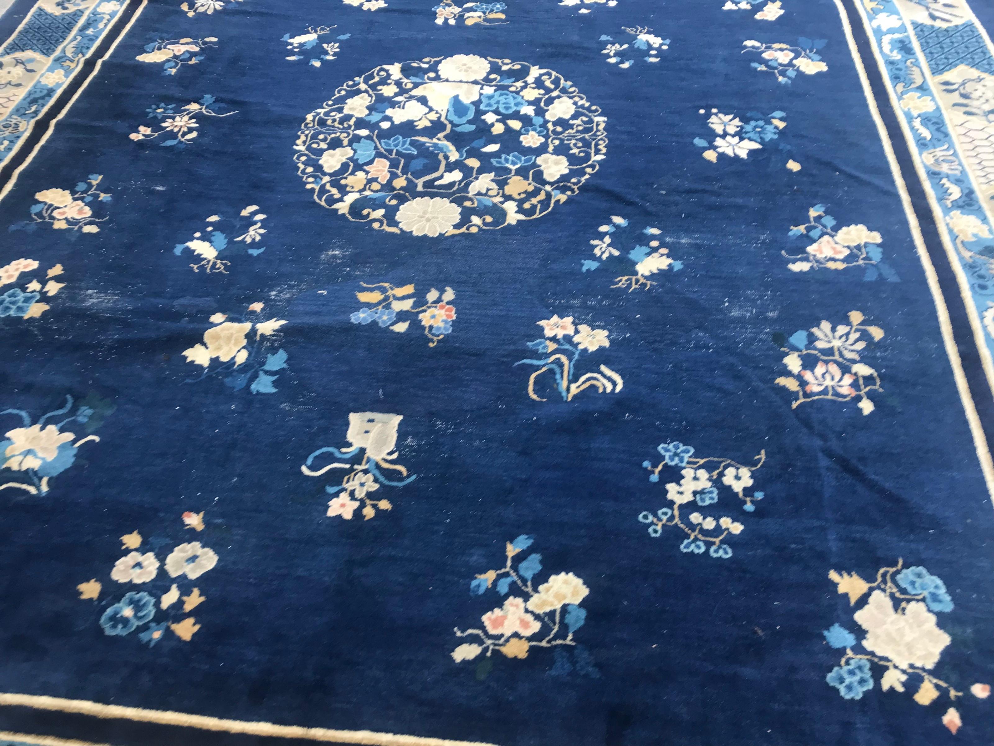 Very beautiful large antique Chinese rug with a beautiful Chinese design and a blue field color, entirely hand knotted with wool velvet on cotton foundation.